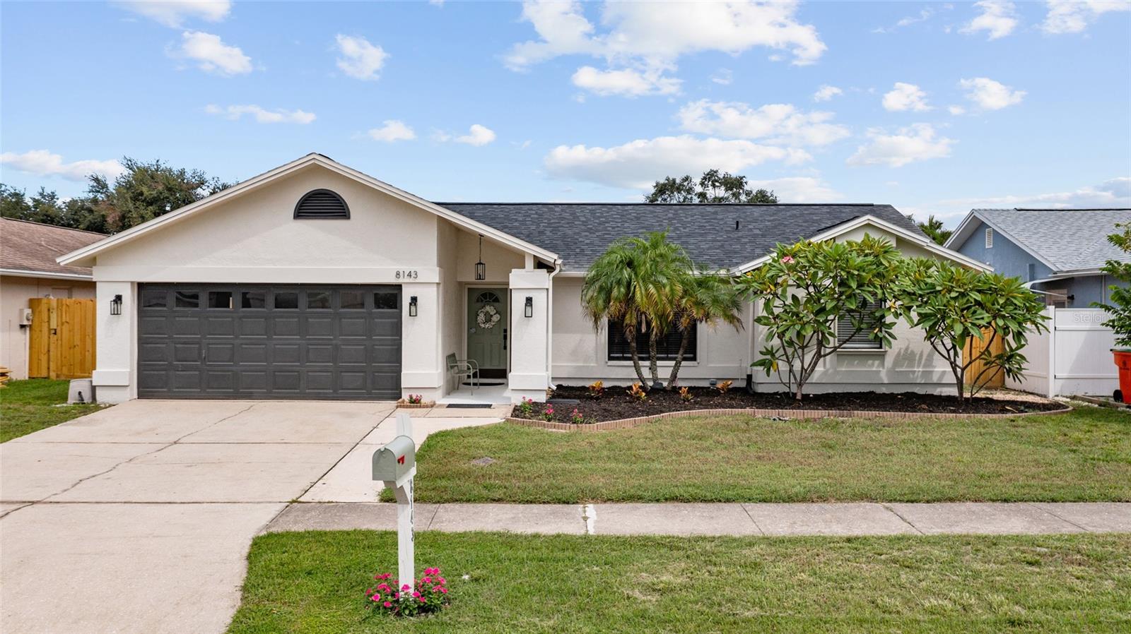 Fully remodeled and move-in ready! Located in a quiet, well-maintained neighborhood in unincorporated Pinellas County, this beautifully updated home blends modern style with everyday comfort. Recent upgrades include a brand-new kitchen with quartz countertops, remodeled bathrooms, LVP flooring, new interior doors, fans, lighting, fresh landscaping, and new blinds on the windows. The main living area features vaulted ceilings, creating a bright and open atmosphere, while the split floor plan offers two separate living spaces—perfect for entertaining or multi-generational living. A cozy wood-burning fireplace adds warmth and character, and the outdoor space is a true retreat with a remodeled pool area, refurbished and rescreened birdcage, and new fencing. The home also features roll-down hurricane shutters for added protection. With a new roof in 2025 and a prime location near major travel routes, beaches, shopping, dining, and attractions—with no HOA—this home checks all the boxes. Schedule a showing with your agent today before it is too late!