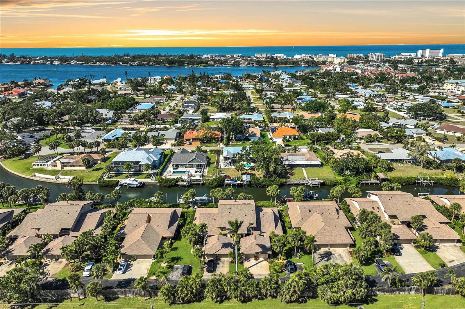 One or more photo(s) has been virtually staged. NEW AND IMPROVED PRICE! Welcome to your waterfront dream home in the gated community of Schooner Bay – a hidden gem in the heart of Sarasota. This rarely available canal-front home offers the ultimate boater’s lifestyle, complete with a deeded dock just steps from your back door and direct access to the Intracoastal Waterway and Gulf of Mexico. Imagine sunset cruises, waterfront dining, and morning coffee overlooking tranquil waters from your expansive screened-in patio. Inside, you'll find a well-designed split floor plan with 3 bedrooms and 2 updated bathrooms, offering both privacy and comfort. The eat-in kitchen is perfect for entertaining, featuring generous counter space and ample storage. The primary suite includes a beautifully updated ensuite bath, making it your own private retreat. This home sits 11 feet above sea level in a quiet community of just 37 homes, where residents enjoy access to a clubhouse and heated swimming pool. Located minutes from Siesta Key’s world-famous beaches, and close to Sarasota’s cultural attraction, shopping, dining and more, this is more than a home; it’s a lifestyle. Whether you're a full-time resident or looking for the perfect second home, this is where coastal charm meets everyday convenience. ¤ Please see 3D Tour and Video ¤