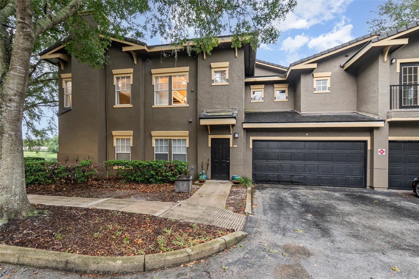 Discover LUXURY LIVING in this beautifully updated 2-bed, 2-bath LAKE VIEW Condo with an attached 2-car garage, located in the gated community of Notting Hill, just minutes from I-4, top restaurants, and shopping centers. Enjoy RESORT-STYLE amenities including two pools, tennis courts, a clubhouse, fitness center, walking trails, and a playground. Updated kitchen with stainless steel appliances, granite countertops, and a breakfast nook; Other property highlights include: crown molding, architectural details, a huge walk-in closet, inside laundry, and a covered patio in front of the lake. The split floor plan ensures both comfort and privacy. The HOA covers Water, Pest Control, Exterior Maintenance, Grounds Maintenance, Recreational Facilities, and Trash. Don’t wait, schedule your showing today!