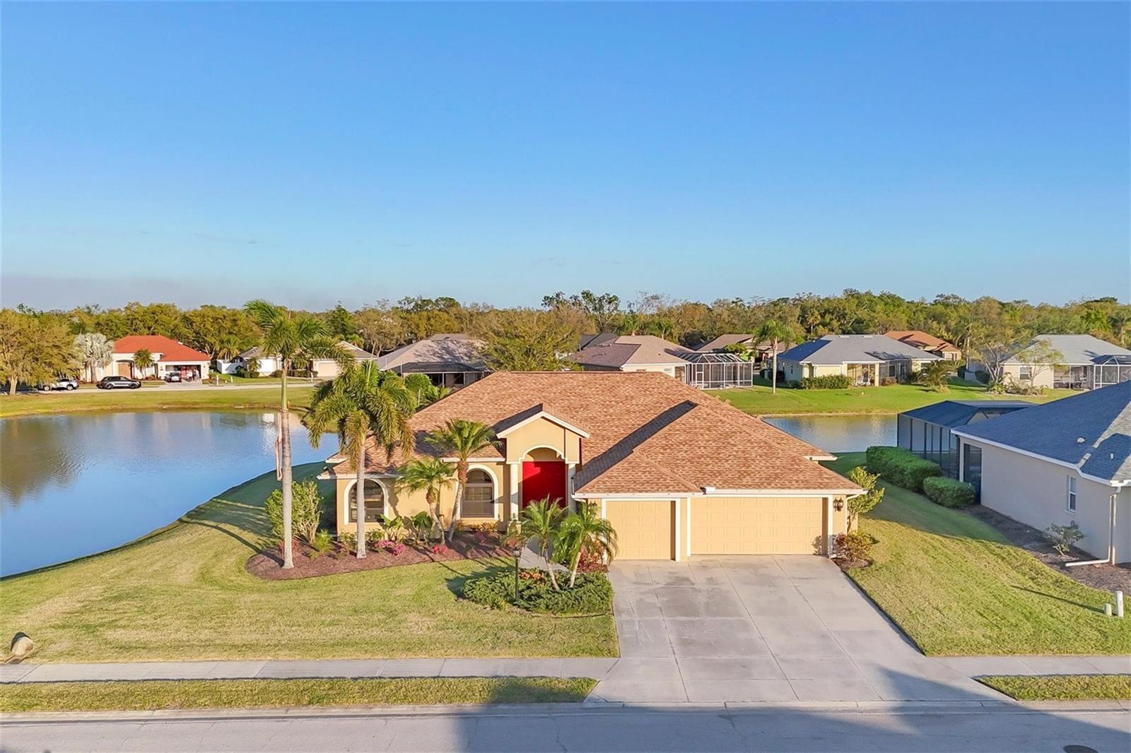 Beautiful 4 Bedroom 3 Bath Ranch with 3 Car Garage(638 sqft) located on the most Scenic water waterfront lot in Laural Meadows. All new kitchen with Quartz counter tops, stainless steel appliances, all 3 baths remodeled with new vanities, New Luxury vinyl flooring, New Roof 2022, PGT Hurricane (tilt in) Impact Windows, Hurricane Rated Garage Door, and New Central air system 2019. Master Bedroom offers walk-in closet and Spacious Master bath with double vanities along with both bathtub and walking shower. Oversized screened lanai with inground Pool, covered Barbecue area overlooking Peaceful lake on 2 sides. Laurel Meadows is conveniently near shopping , dining, golf courses, Rothenbach Park, Celery fields for hiking and bird watching and just a short drive Nearby Beaches and Downtown Sarasota. Property is located in flood zone X no flood insurance required. Just move in ... Welcome Home!!!