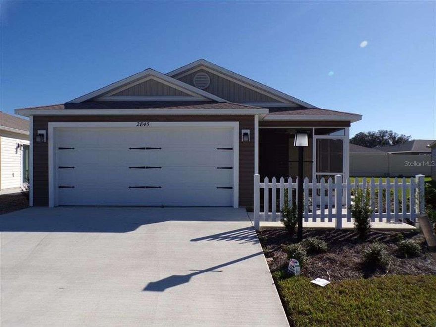 Welcome to The Village of Richmond – Topaz Model, Vinyl Sided, Furnished Patio Villa with Possible Lease Option to Buy Comfort meets elegance in this spacious two-bedroom, two-bath, 2 car garage where you will step inside & you’re greeted by a bright, open-concept retreat designed for both relaxation and entertaining. The professionally decorated interior features high-end touches and calming finishes that create a warm, inviting atmosphere. The living area flows seamlessly into the dining and kitchen spaces, allowing for easy conversation and effortless hosting. The oversized kitchen island provides generous seating and is perfect for gathering with guests. The eat-in kitchen showcases: White shaker-style cabinetry, Gas stainless steel appliances, Ample counter space, Abundant storage & modern amenities, Laundry Area. The primary suite is a true sanctuary, featuring a king-size bed and a private en-suite bath with Double sink vanity, Walk-in shower, Spacious walk-in closet. The second bedroom offers a queen-size bed, high ceilings, ceiling fan, and plenty of storage. A full hall bathroom with tub/shower combination and single sink vanity serves guests comfortably. Additional features include: Dedicated laundry area, Multiple storage closets, Sliders leading to a private patio, Nicely maintained side and backyard space, Prime Location. Conveniently located near: Brownwood Paddock Square, Lake Okahumpka Recreation Center, Richmond Pitch & Put, Pools, golf courses, recreation sports, Walking trails, shopping, restaurants, and entertainment. Just a short drive or golf cart ride to: Sawgrass Grove, Ezell Regional Recreation Center, Eastport, Middleton & Lake Sumter. POSSIBLE Lease Option to Buy – Inquire for Details FULLY FURNISHED!!