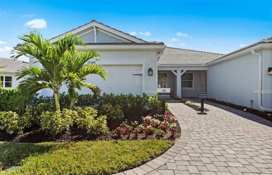 This Ellenwood Floorplan is an inviting attached villa offering 2 bedrooms, 2 bathrooms, enclosed flex and 2-car garage. Designed for modern Florida living, the home features a spacious gathering room, screened brick-paver lanai, and 8' interior doors throughout. The kitchen is beautifully appointed Aristokraft cabinetry, Quartz Counters, and a full suite of stainless-steel KitchenAid appliances, including range and exterior-vented microwave. Additional upgrades include cabinets in laundry room, utility sink, whole-house impact-resistant windows, an electric car outlet in the garage. With thoughtful details and finishes, this new construction home delivers comfort, style, and convenience. Discover new homes at Shores at Stillwater-by Pulte Homes, your ideal new home builder. Soak up the sun at the private community with miles of walking or biking to pristine beaches, shops and restaurants.