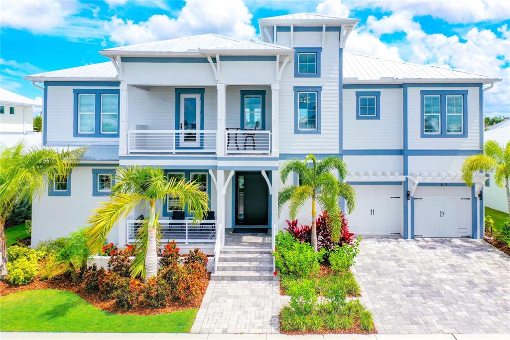 This luxurious modern coastal home is a rare find in the desirable waterfront community of MiraBay! Welcome inside this 4 BD and 4 BA, two-story residence that spans over 4,000 SF. Recently built in 2021, this home redefines the modern coastal architectural style and is completely move-in ready. Immediately upon entering the home, residents will find a spacious open floor plan filled with an abundance of natural light and unobstructed water views! This luxury modern coastal home is situated on the canal with quick and easy access to Tampa Bay! Just a 25-minute boat ride to downtown Tampa or St. Petersburg, you can enjoy both sides of the bay! Included with this home is a prepaid dock with a 10,000-pound lift (UPDATE - DOCK COMPLETED) After a long day on the water enjoy beautiful sunsets from your outdoor living area. The outdoor kitchen has everything you need and more! Additional upgrades include a built-in central vac system, oversized 5 X 8 Steel Pivot Door with auto-close functionality, walk-in 72 bottle refrigerated wine cooler, fully automated window shades inside and on the second level balcony, fully remote-controlled storage shelves in the garage, upgraded LED mirrors and so much more! This smart home has too many features to list! Please find attached detailed upgrade list for additional information. The MiraBay Community offers resort style amenities: fitness center, parks, clubhouse, café, outdoor heated pools with waterslide, tennis, pickleball, and basketball courts. They also offer water sport activities including kayaks and paddleboards! You must see this one-of-a-kind modern coastal home!