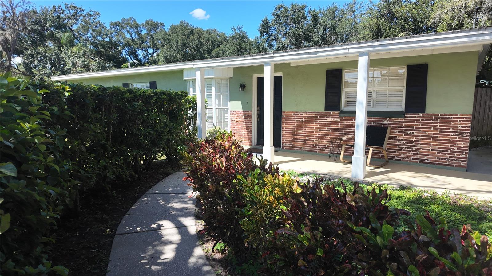 Beautiful well kept Lake Magdalene home in a highly desirable Carrollwood location with an in-law Suite! The In-law suite features a dining area, living area, full kitchen (no stove), bedroom & bathroom. Separate entrance through the courtyard area with shared laundry room connected to both homes. Courtyard features a private Oasis with mature landscaping, trees & flowers. The main home offers 3 oversized bedrooms with 1 on suite bathroom and new carpet. Luxury Vinyl throughout dining and living areas. Plantation shutters on all the windows giving the home an upscale look. Grand dining area and very functional kitchen with newer appliances and plenty of cabinet space. Yard is private and fully fenced. Relax during those hot summer days at your private above ground pool! A/C is less than 5 years old and all plumbing has been updated to code in 2025. This is a must see home close to 275 & shopping and everything Carrollwood has to offer.