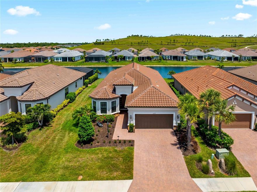 Live the Florida Resort Lifestyle – No CDD Fees & Luxury at Every Turn!

Welcome to your private Florida retreat—an impeccably upgraded and maintained pool home tucked inside one of the area’s most sought-after gated Esplanade communities. Featuring 3 bedrooms, 3 full baths, a dedicated home office, and high-end finishes throughout, this home blends upscale comfort with effortless entertaining.

Love to cook? You’ll appreciate the rare and highly desirable natural gas cooking both indoors and out. The gourmet kitchen showcases a premium gas cooktop, perfect for any home chef, while the outdoor kitchen with a built-in gas grill makes al fresco dining and poolside gatherings seamless.

Step outside to your extended screened lanai and sparkling pool overlooking a peaceful, man-made waterway—the ideal setting for entertaining or unwinding at sunset.

Inside, the open-concept design is filled with natural light, soaring ceilings, and thoughtful builder upgrades throughout, brand new carpets in the bedrooms—truly move-in ready.

Golf enthusiasts will love the proximity to world-class courses, including The Concession Golf Club, Waterlefe Golf & River Club, River Strand Golf & Country Club, and IMG Academy Golf Club.

Enjoy being just minutes from top destinations like The Mall at University Town Center for premier shopping and dining, vibrant Downtown Sarasota and Downtown Bradenton, charming St. Armands Circle, and the stunning shores of Bradenton Beach and Siesta Key Beach—all within a 16-mile radius.

Community Features Include:

Gated entry for privacy and security
Resort-style pool & spa
Elegant clubhouse & social spaces
Fully equipped fitness center
Tennis & pickleball courts
Scenic walking and hiking trails directly behind the home
Residents also enjoy access to shared amenities across other Esplanade communities—all with no CDD fees.

Whether you’re searching for a full-time residence, a seasonal escape, or a smart investment, this home delivers the Florida lifestyle at its finest.