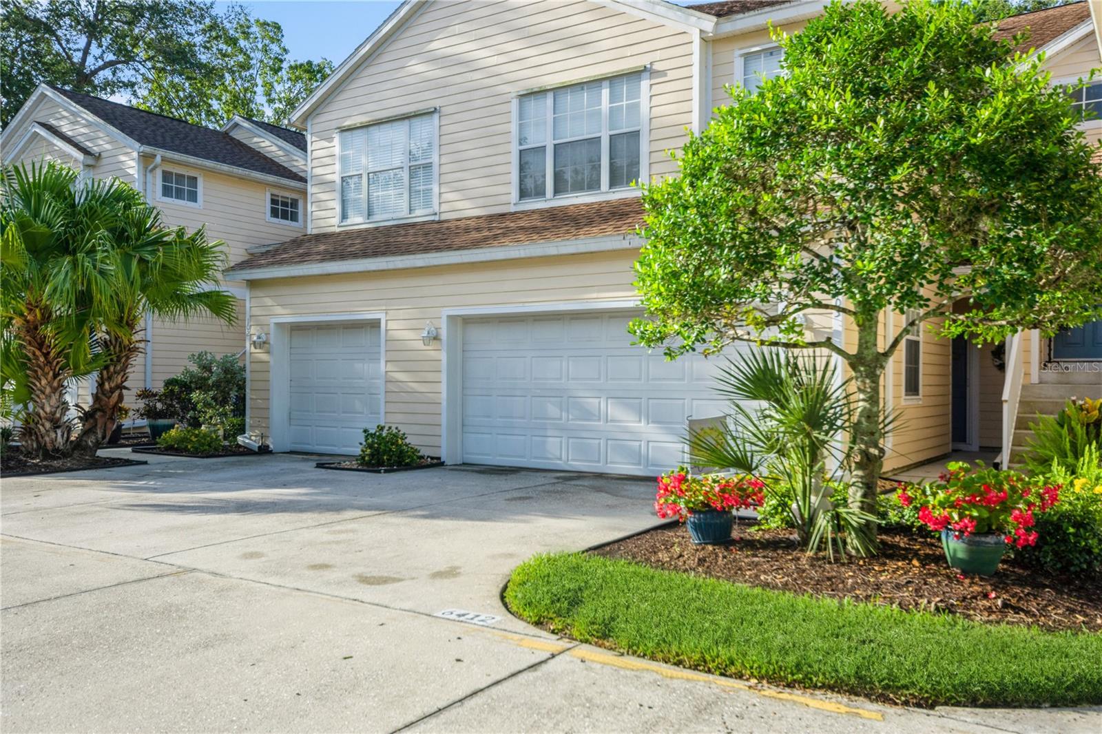 Discover unbeatable value in the heart of Lakewood Ranch at Summerfield Hollow - a sought-after condominium community known for its convenience and charm. This spacious 2-story Harbortown floorplan offers 1,691 sq ft. of well-designed living space, complete with a private attached 2-car garage. Step inside to a welcoming foyer with a retractable screen door, perfect for enjoying the superb Florida winter weather. The main level features a generous eat-in kitchen with granite countertops, stainless steel appliances, recessed LED lighting, and a pantry - flowing seamlessly in an open-concept living and dining area ideal for entertaining or relaxing with family. Soaring 20-foot ceilings in the living room create a dramatic and airy atmosphere rarely found at this price point. Upstairs, a versatile loft space makes a great home office, guest area, or potential third bedroom, and includes a laundry closet with washer and dryer. The two upstairs bedrooms each have their own full bathrooms with granite countertops and private water closets. The primary bedroom boasts a walk-in closet, and an en suite bathroom with dual sinks, a soaking tub, and separate shower. Enjoy serene views of a preserve and pond from your screened-in lanai with ceiling fan - your own private retreat. Additional highlights include 2022 roof replacement and fresh exterior paint, and a condo fee that covers water, sewer, trash, pest control, building insurance, lawn and building maintenance, basic cable, reserves, and property management. Live just minutes from top-rated schools, shopping, dining, parks, and all the benefits of living in Lakewood Ranch. Whether you're a first-buyer, downsizing, or looking for your affordable Lakewood Ranch getaway, this move-in ready town home delivers the perfect mix of space, style and value.