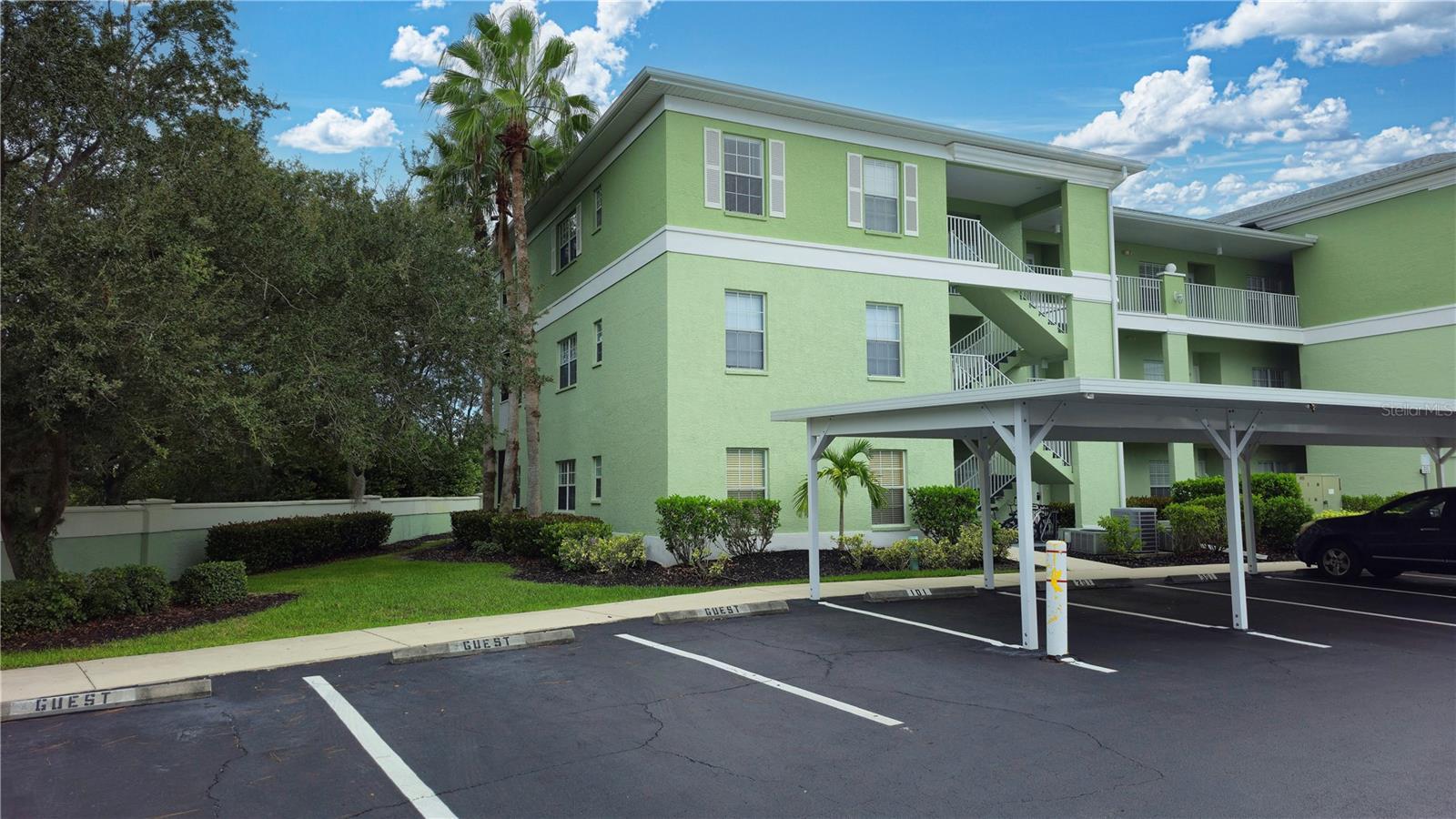 This first floor, end unit, 3/2 condo offers a serene, private location in an active, gated, nesting bird sanctuary community. Your covered parking spot is right outside your front door: just wait until you step inside and experience the happy in this home! Fabulous open, split bedroom floor plan with an eat-in kitchen and super lanai area that opens to a preserved wetland area. Great community location for quick & easy access to everything, including one of many public golf courses, just down the street. Make your appointment to see this home today: seller is including a one-year home warranty!