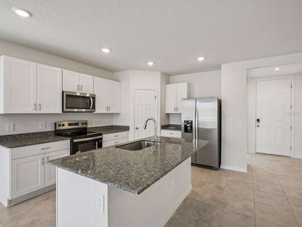 Photo of 3933 Giorgio Drive, Winter Haven, FL 33884 (MLS # TB8546812)