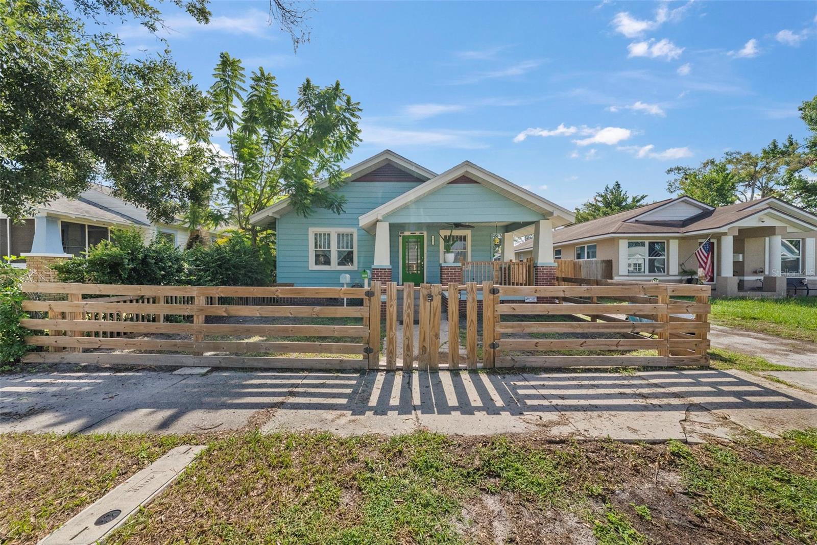 Welcome to this charming 3-bedroom, 2-bath Craftsman bungalow, ideally located in the sought-after North Kenwood neighborhood of St. Petersburg, FL. Situated on one of the highest elevations in Pinellas County, this property is in the Non-Evac and X flood zone—offering added peace of mind and long-term value. Inside, you’ll find original hardwood floors, a cozy breakfast nook, and a harmonious blend of historic character and thoughtful modern updates. The HVAC system was replaced in 2022, providing efficient, year-round comfort. A standout feature is the detached two-story Accessory Dwelling Unit (ADU), currently leased through February 2026—making it an excellent source of passive income. The lower level of the ADU also includes a newly finished office space, ideal for remote work or creative pursuits. Additional highlights include alley access with extra parking, an RV electrical hook-up, and a private outdoor area perfect for entertaining or relaxing. All of this is just minutes from Downtown St. Petersburg, award-winning Gulf beaches, and an array of shopping and dining destinations. Whether you're looking for a primary residence with added income or a savvy investment opportunity, this unique property delivers on all fronts. Schedule your private showing today—this one won’t last! Buyer to verify all measurements and all ADU information and specs.