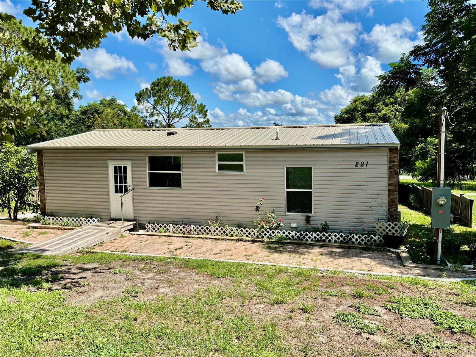 MOTIVATED SELLER!! This 2 Bedroom / 2 Bath Manufactured Home has been COMPLETELY Remodeled. The Home sits on almost a 1/4 acre lot. A Bright and Well Maintained Home. Plenty of cabinets and counter space in the Kitchen. The Island in the Kitchen has the Stove Top area and sitting area.The Living Room has Double Doors that lead outside. The Laundry Room is located beside the Kitchen easy access. It's a MUST SEE HOME!!! Located just 5 min from the Villages, Restaurants, Shopping, Medical Offices.
