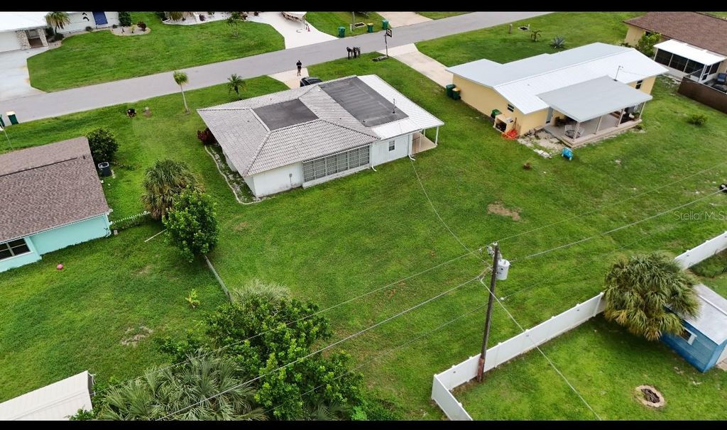 Photo of 448 Blossom Avenue NW, Port Charlotte, FL 33952 (MLS # A4680449)