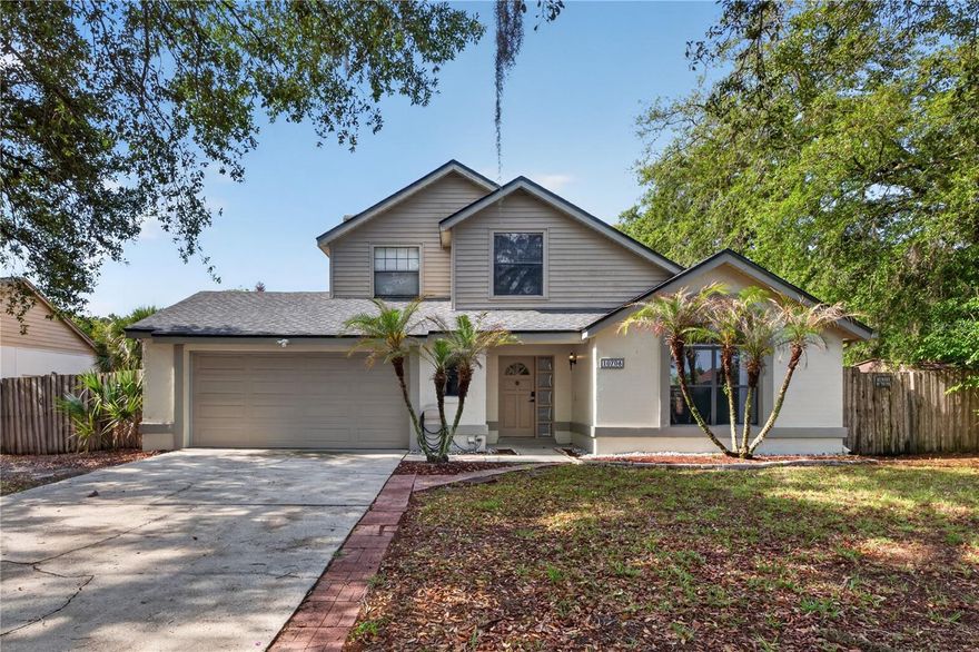 Looking for a spacious, move-in ready home in a great location?  This 3 bedroom, 2.5 bath home with a 2-car garage is located only 1.6 miles from University of Central Florida.  Inside, you’ll find over 1,600 sq. ft. of living space with vaulted ceilings, formal living and dining rooms, plus a comfortable family room with a wood-burning fireplace.  The kitchen was updated about a year ago with quartz countertops and backsplash and overlooks the family room, making it perfect for everyday living and entertaining.  The spacious primary bedroom offers plenty of room to relax, and the upstairs bathroom includes a bathtub with Jacuzzi jets.  Other features include some smart light switches and pre-wiring available for cameras.  Step outside and enjoy the screened-in pool area with a freshly painted pool deck, covered patio space, fenced backyard, and aluminum storage shed.  The outdoor space also includes a beautiful water feature with a small fountain, creating a relaxing atmosphere by the pool area. Roof was replaced in 2024.  Great layout, plenty of space, and an excellent location.   Ready for its next owner to move right in and enjoy.
