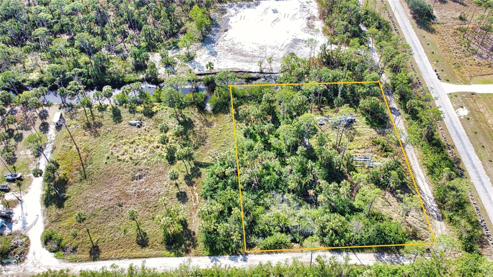 Street address is for listing purposes only and will receive an actual street address once improved. Discover a rare and exciting opportunity to design and build your dream home on this stunning residential 1-acre corner lot. Tucked away in a serene and private location, this property offers a harmonious blend of natural beauty and convenience. Nestled just north of the picturesque Myakka State Park, the land is bordered by pristine Florida nature, providing an idyllic setting for your future home. The property is close to Myakka River, offering a unique lifestyle for nature lovers, boating enthusiasts, or those seeking a peaceful retreat. Despite its secluded feel, the parcel is conveniently located just east of the highly desirable Wellen Park community, ensuring access to shopping, dining, and other everyday amenities. Looking to the future, the planned extension of River Road will further enhance the location's accessibility, providing a direct connection to the newly built high school and the pristine sands of Manasota Key Beach. This property truly offers the perfect combination of tranquility, convenience, and potential. Clean environmental survey. There is a small area of wetlands in the northeast corner which will not impede on building envelope. Zoned RE1. Lot dimensions are approximate and should be verified by buyer. Please see additional parcels that are available - MLS # A4637388, A4637409, and A4637413.
