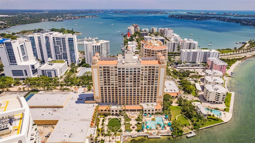 Truly a must see penthouse condo on the top of the Ritz Carlton Hotel occupying an impressively large portion of the 18th floor. Enjoy breathtaking panoramic views of the picturesque Sarasota Bay. From the moment you step inside, you'll be greeted by awe-inspiring vistas that stretch from the vibrant Marina Jacks to the majestic John Ringing Bridge. This luxurious residence offers an expansive living space spanning nearly 5,000 under air, designed to indulge you every desires. This exquisite condo boasts three spacious bedrooms and three and a half baths, offering ample room for relaxation and privacy. The thoughtfully designed layout features an elegant executive office, a chefs dream kitchen equipped with it's own pizza oven and wine refrigerator. The penthouse offers a convenient west wing dedicated to the master quarters ensuring maximum comfort and seclusion. The east wing is reserved for the remaining bedrooms, providing an ideal space for family members or guests. Impeccable attention to detail is evident throughout the residences with high-end finishes and luxurious touches gracing every room. The expansive window capture natural light, enhancing the open and airy ambiance. From the living spaces to the bedrooms, the remarkable views of Sarasota Bay serve as a constant reminder of the coastal paradise that surrounds you. In addition to the exceptional interior, residents of this remarkable condo will have access to a host of world class amenities. Take advantage of the buildings state of the art fitness center, sparkling pool, and inviting communal areas. Indulge in the ultimate in luxury living and enjoy the convenience of a prime location, with vibrant dining, shopping, and entertainment options all at your finger tips.