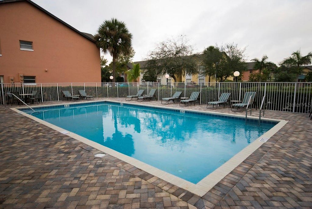 Photo of 4202 Pershing Pointe Place #3, Orlando, FL 32822 (MLS # O6446625)