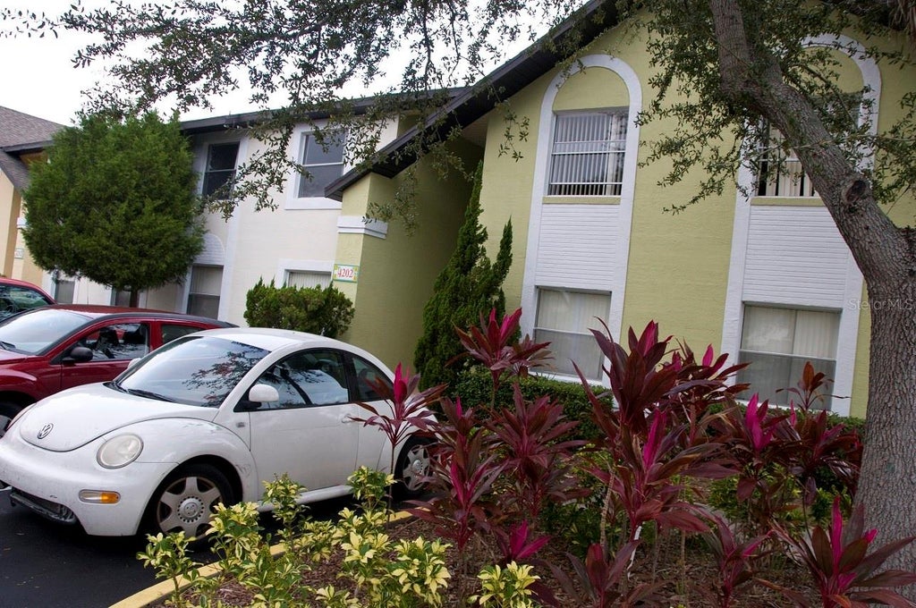 Photo of 4202 Pershing Pointe Place #3, Orlando, FL 32822 (MLS # O6446625)