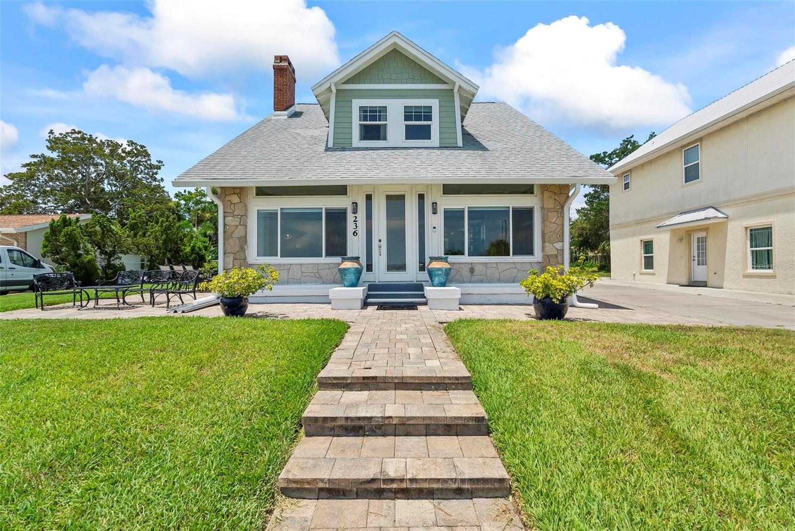 This beautiful historic home built in 1920 was recently renovated and brought to present time comfort and taste without taking away the home's character with a well appointed, large kitchen that opens to the living and dining areas. Past the living room you'll find a Florida room with expansive views of the Intracoastal Waterway and your own boat dock with a boat lift. Also on the first floor is a bedroom with full bath next to it that can be used as an in-law suite or master bedroom. Climbing the beautiful wooden stairs you'll find the master bedroom with a fully remodeled bathroom and another guest room. This house has a surprise with an unfinished 1,120Sq.Ft basement. In the back yard is the oversized garage with a beautifully finished appartement, complete with a kitchen that can be used for rental or family. This is an amazing opportunity to own a home with historic character and modern comfort and room for a boat and your other toys.