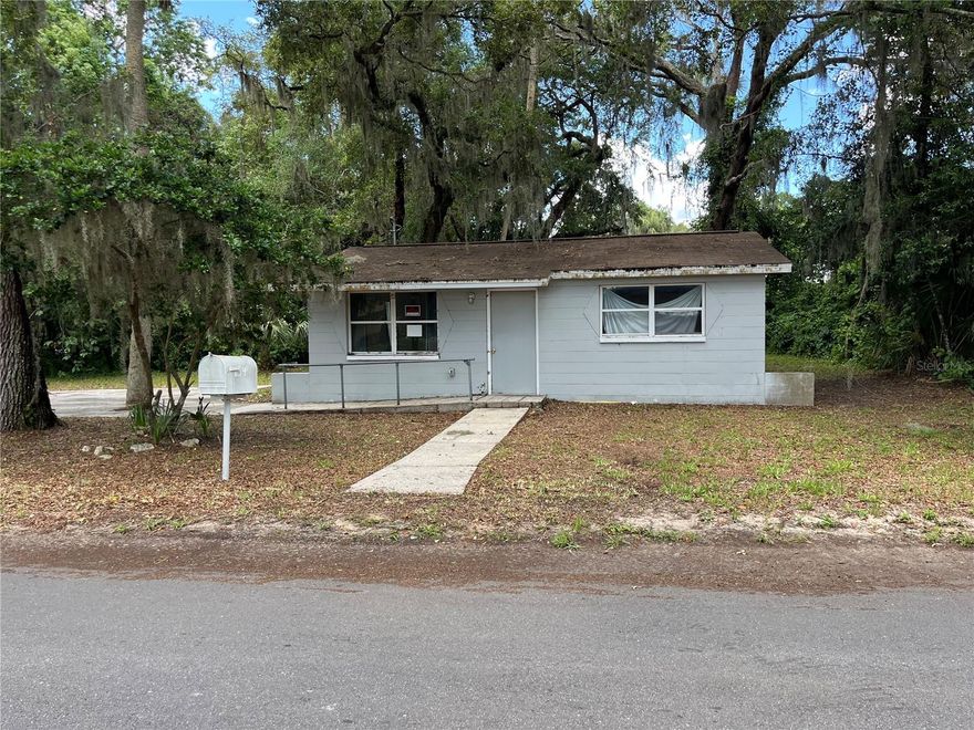 ***ZONED COMMERCIAL/RESIDENTIAL***Opportunity is knocking in the heart of Crystal River! This 2-bedroom, 1-bath concrete block home sits just behind Burger King and right off Hwy 19, offering unbeatable location and visibility. Zoned CG – Commercial General, the property allows for both residential living and a wide range of business uses—perfect for an investor, small business owner, or someone looking to renovate into a rental. Inside, you’ll find 667 sq ft of potential, with vinyl flooring, a range included, and public utilities already connected. No HOA and situated on a paved road with mature trees. With a little TLC, this could become an income-generating rental, office space, boutique shop, or even a live/work setup. Enjoy close proximity to the historic downtown area, Hunter Springs, Kings Bay Park, and the famous Three Sisters Springs—all within a mile! Outdoor lovers will appreciate being in Citrus County, surrounded by protected lands, wildlife, and recreational activities like scalloping, kayaking, fishing, and swimming with manatees. Whether you're looking to invest, relocate, or launch a business—this property is brimming with possibilities. Don’t miss it!