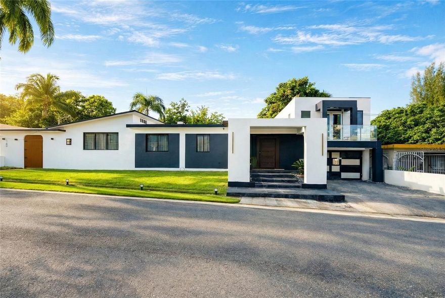 Discover this excellent opportunity in the community of Colinas del Yunque, an area defined by its natural surroundings and tranquility. This single-level residence of approx. 2,663sf features four bedrooms and three and a half bathrooms, and sits on an expansive lot of approximately 1,500sm. Located in a prime area of Río Grande, the property is just minutes from El Yunque, beaches, shopping centers, and major roadways. It offers an ideal balance of privacy and convenience, making it suitable as a primary residence or an investment property. Enjoy a refreshing atmosphere, lush green views, and a peaceful neighborhood, perfect for those seeking a high quality of life in the eastern region of Puerto Rico.