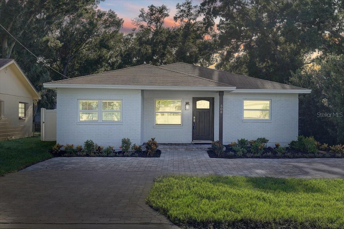 Welcome to this move in ready 3 Bedroom/2 Bath home located in the heart of South Tampa and zoned for top-rated schools—Mitchell Elementary, Wilson Middle, and Plant High. This meticulously maintained home is steps from Kathy Echevarria Greenspace and all the best shopping, restaurants and entertainment that South Tampa has to offer. Within walking distance to the new Midtown this home offers a central location just minutes from Kennedy Blvd, I-275 and Downtown Tampa. Outside, enjoy fresh exterior paint (2025), new landscaping with vibrant hibiscus and croton plants, garden rocks, fresh mulch, and new sod (all 2025). The oversized paver driveway and fully fenced backyard with paver patio creates a perfect setting for outdoor living. Ideal for entertaining and enjoying the Florida lifestyle. For storage and peace of mind the home includes a storage shed with hurricane shutters to match the newer windows throughout the home. Inside, the home boasts fresh interior paint (2025) and an upgraded gourmet kitchen with white cabinetry, crown molding, granite countertops, deep metal farm sink with newer faucet, stainless steel appliances, recessed lighting, and abundant storage. Home comes with a stainless steel washer and dryer and indoor laundry/utility room for home-keeping convenience. The primary suite offers a spacious closet, ceiling fan, and en-suite bath with a granite vanity, glass-enclosed stand-up shower, and upgraded fixtures. Two additional guest bedrooms—each with large closets and ceiling fans—share a beautifully updated bathroom with granite vanity, newer shower head, and upgraded new faucet. This home blends style, comfort, and convenience in one of Tampa’s most sought-after neighborhoods at an affordable price—Make sure you come and visit this home to see it for yourself, you will not want to miss it. Sit out back on Sundays and enjoy the Tampa Bay Buccaneers flyovers while grilling and chilling in your new humble abode. Just bring your toothbrush and make it your own, this home is ready for its next owner to enjoy.