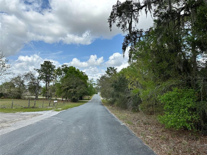 WILLISTON HIGHLANDS UNIT 5 PAVED ROAD BUILDING LOT. Discover the perfect opportunity to own a 0.44 acre corner lot on two paved roads in Morriston. This spacious parcel offers excellent accessibility and visibility thanks to its desirable corner location, while still providing the peaceful rural atmosphere that makes the Williston Highlands community so appealing. With nearly half an acre of land, With pastures and a horse farm across the street gives for beautiful views in the country, there’s plenty of room to design your future home, place a manufactured home, or hold as an investment in a growing area. Enjoy the charm of country living while remaining just a short drive from shopping, dining, and the natural beauty of North Central Florida. Whether you’re planning to build now or invest for the future, this property is a fantastic opportunity.