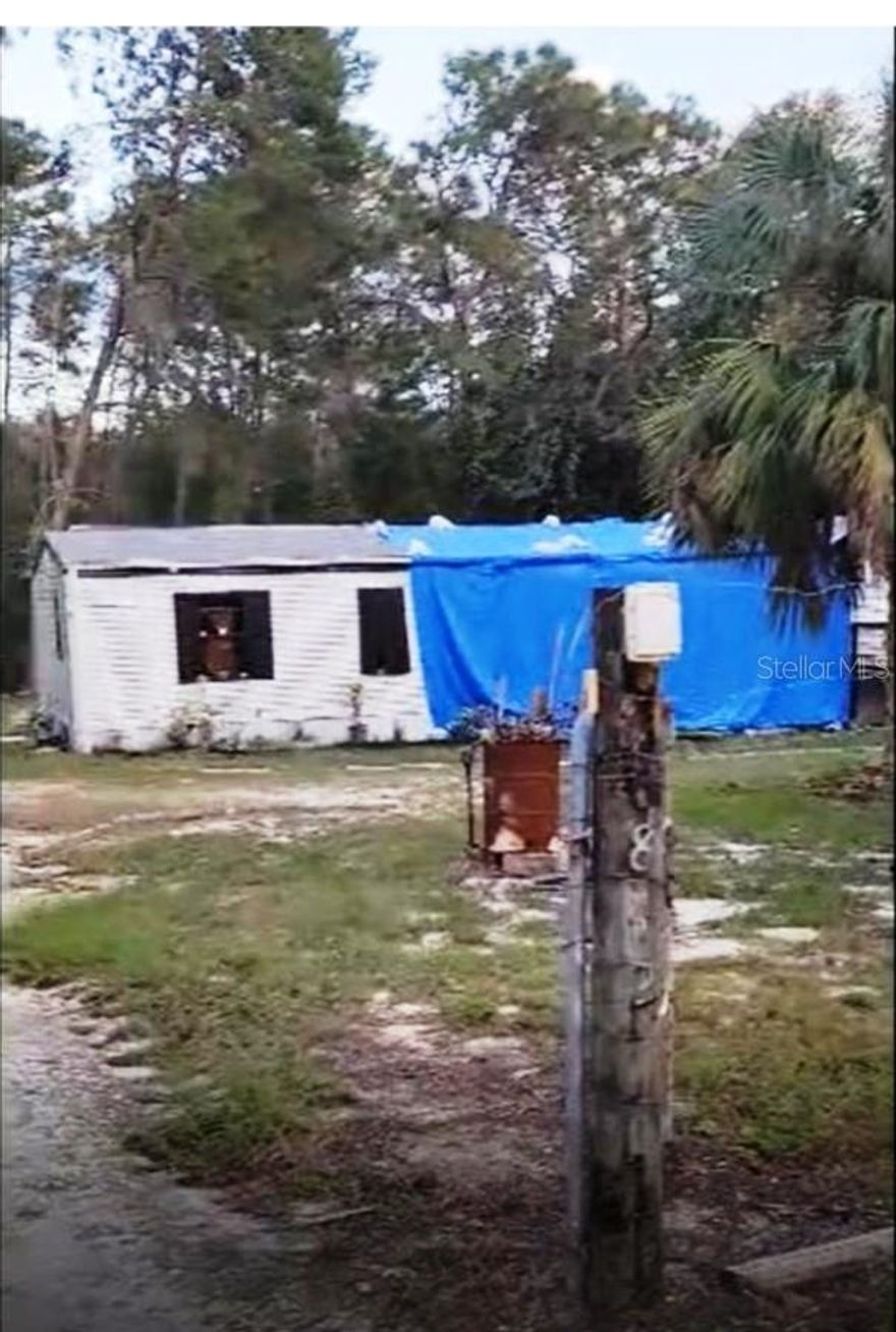 Great investment opportunity on 1.31 acres of private land in Hudson! This 3 bedroom, 2 bath mobile/manufactured home (built 1995) features a desirable split floor plan with the master suite on one side for added privacy. The property includes three storage sheds, one of which is newer (14 × 10) and equipped with its own electrical sub-panel—perfect for a workshop or hobby space. Recent updates include a 5-year-old AC and two sub-panels (9 years old). The home needs a new roof and kitchen repairs due to a past leak that caused water damage and mold in the kitchen area—priced accordingly for investors or handy buyers looking for a solid value-add project. Enjoy peace and privacy with plenty of space to expand, store equipment, or create your own outdoor oasis.