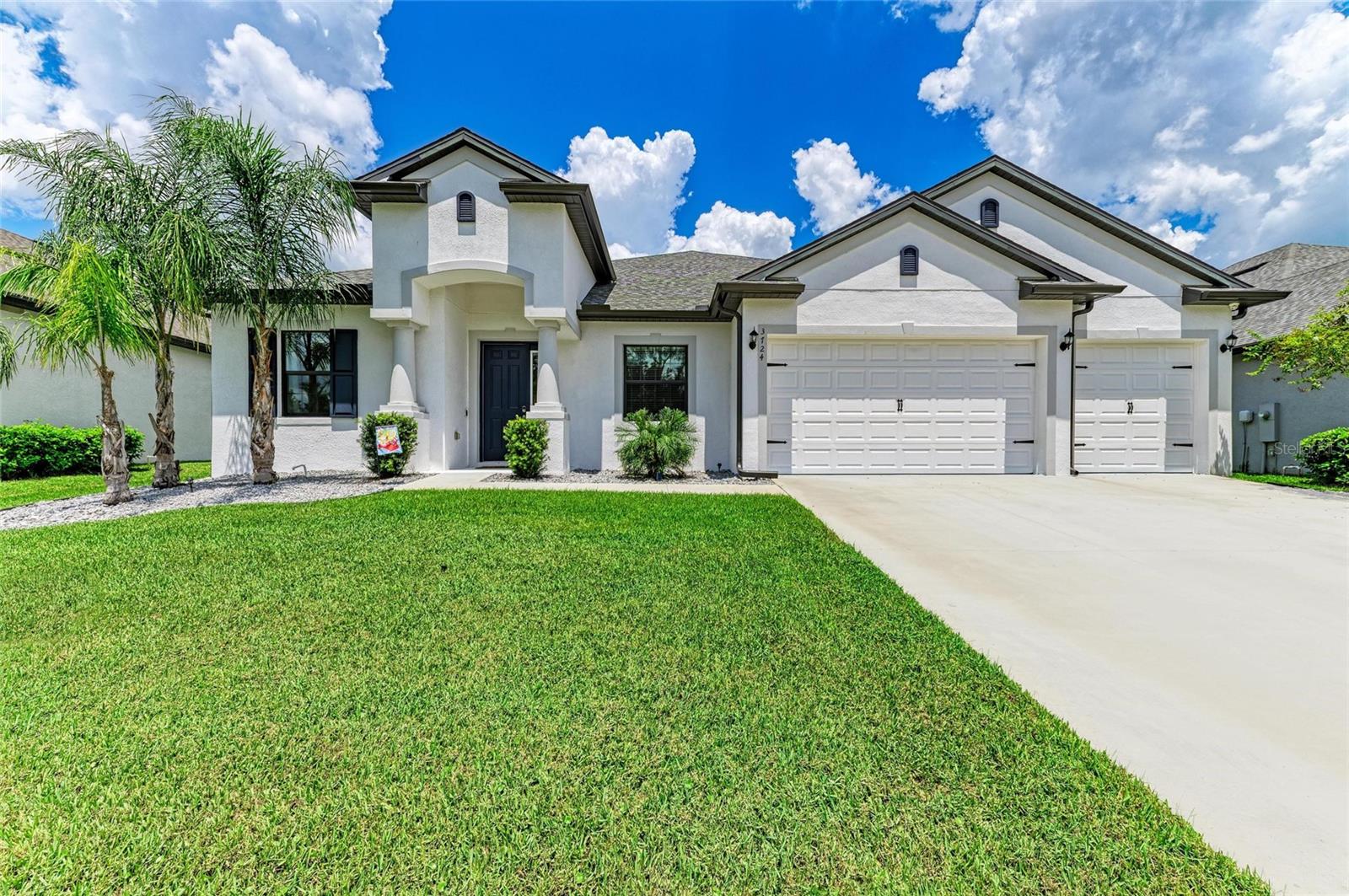 This gorgeous 4-bedroom, 5-bathroom pool home with a spacious 3-car garage and nearly 4,000 sq ft of living space is in the highly desirable community of Cross Creek. Designed with both comfort and functionality in mind, this home is packed with upgrades and luxury finishes throughout. Inside, you’ll find two master suites, each complete with dual sinks, quartz countertops, tiled showers, and over-sized walk-in closets with custom shelving. Two additional bedrooms downstairs also feature custom walk-in closets and are accompanied by two more full bathrooms with quartz and tile finishes. An additional living/dining room is at the front of the home which the owners use as a home office. Upstairs, a massive bonus area offers endless possibilities—perfect for a game room, theater or possible 5th bedroom along with the 5th full bathroom. The main living area boasts luxury vinyl plank flooring throughout. The gourmet kitchen comes with stainless steel appliances, tiled backsplash, quartz countertops and a massive 12.5 ft island. It comes pre-wired for pendant lighting, external ventilation above the range and a large pantry with custom shelving. Off the kitchen is the large family room which flows seamlessly to the outdoors. Outside you’ll enjoy a covered lanai with a full outdoor kitchen. The covered lanai has been upgraded with electric retractable solar shades for added comfort and privacy. The saltwater pool and hot tub is currently set up on an electric heater but has gas hookup available. This home is built for convenience and peace of mind with hurricane impact-rated windows and doors, natural gas hookups (water heater, dryer, range, outdoor grill, pool heater, emergency generator), gutters, a full security system with cameras, multiple WiFi boosters, surround sound (great room, lanai and upstairs bonus room), and a whole-house water purification system. Cross Creek residents get to enjoy resort-style amenities: a zero-entry pool with water slide and splash pad, covered BBQ area, playground, fishing dock, basketball and pickleball courts and dog park. As an added bonus, cable & internet as well as irrigation are included. Families will love being walking distance to a highly rated elementary school and are also zoned for the recently built Parrish Community High School. Ideally located, Cross Creek is just minutes from shopping, dining, Fort Hamer boat launch, and two new county parks. With easy access to I-75, you can be at the beaches, Tampa, St. Pete, Sarasota and two major airports within 45 minutes. This home truly has it all—space, luxury, amenities, and location. Don’t miss your chance to make it yours!