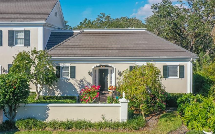 Enjoy the perfect maintenance free country club lifestyle with private tranquil views in this single level end unit in charming Bishopscourt Townhomes. Architecturally designed by Bo MacEwen, these homes feature a formal entry hall, two bedrooms and two baths with generous walk-in closets. A private oasis, this residence is ideal for year-round living or a seasonal getaway. Newer appliances, less than a year new top of the line A/C system, 2021 roof, and new picture windows in the living room and primary suite allow you to take in lush preserve views. A screened patio is perfect for relaxing, reading or enjoying a morning cup of coffee or tea. The guest suite has french doors leading to the patio and a private bath. Membership in the sought after Oaks Country Club offers two 18 hole championship golf courses, 12 Har-Tru lighted tennis courts, 4 pickleball courts, a croquet lawn, state of the art fitness center, and casual and fine dining. Golf or social membership is required. The only thing left is to move in, relax, and enjoy your Florida lifestyle. The Oaks is conveniently located to the area's best beaches, Legacy Trail for biking, and all of the cultural activities in Sarasota County.