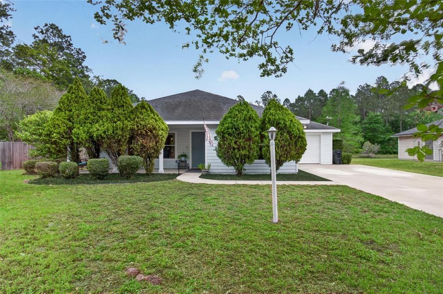 Come visit this beautiful 4/2 home in North Point at Ironwood on a large corner lot with several fruit trees!  This beautifully maintained home has durable tile floors throughout, making it stylish and easy to maintain.  The kitchen is in the heart of the open floor plan. A screened back porch looks out over the backyard and firepit area with a scenic pond view for watching wildlife, including birds and deer.  Whether you are hosting guests or enjoying a quiet night in, this home offers the ideal setting.