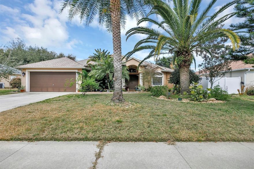 Don't miss your chance to own this beautiful 4 bedroom, 2 Bath home with a BRAND NEW roof!! The open floor plan offers a large chef's kitchen with an entertainers island, a deep farmhouse sink, frosted glass cabinets, granite countertops, and newer stainless steel appliances. Watch TV right from the kitchen as it overlooks the family room featuring custom built-ins including a stone veneer wood-burning fireplace and space for your personal treasures. The split plan offers a large primary bedroom, with double walk-in closets, an updated bathroom that includes double raised bowl sinks, and an updated travertine tile and glass shower enclosure. Head right out to the patio through the sliding glass doors in the primary bedroom. The backyard offers privacy with the fully fenced oversized yard and entertaining and relaxing space under the covered screened patio. Located just minutes from grocery, shopping, I-4, and walking distance to the Spring-to-Spring Trail! This home is a gem and won't last long, schedule your showing today!