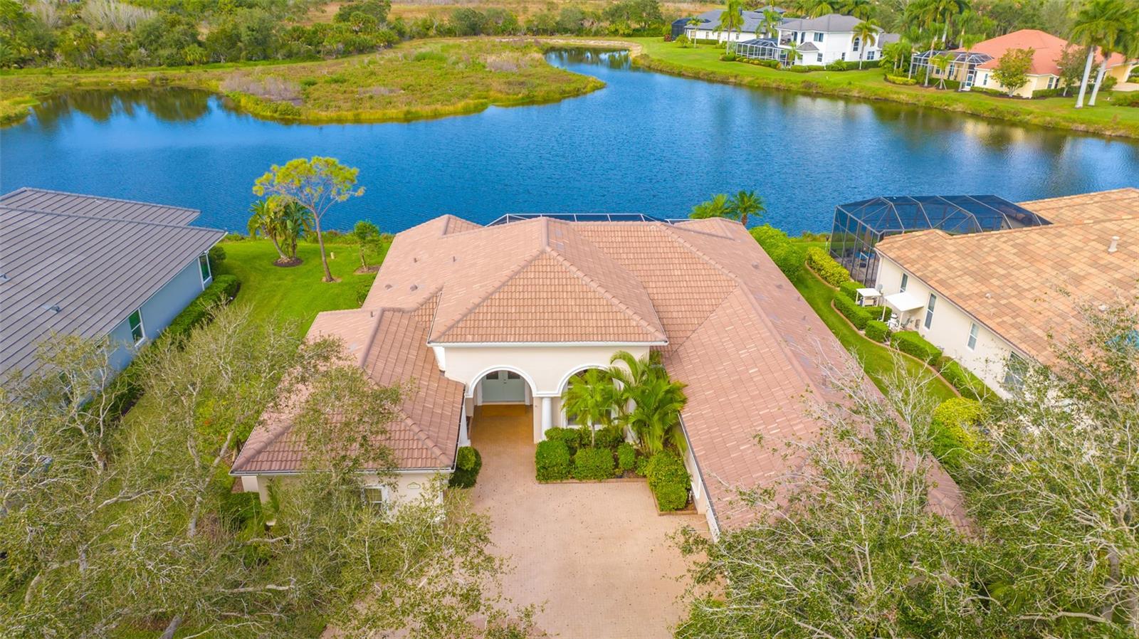 Located on one of the best lots in Silver Oak with expansive water views backed by private preserve (no houses in the back)* This executive home built by Bamboo Luxury Home Bui8lders features a brand new $85,900 roof for lower insurance costs* Unique great room floor plan with 14 ft. ceilings* 3 generous bedrooms plus large office/library* 3.5 baths* Kitchen with new granite counters & new wall oven* Plantation shutters* Recently re-finished & remodeled pool & outdoor kitchen* "Picture Frame Screening" has been installed for unobstructed views of the lake & preserve* Neutral tile throughout living areas with easy care vinyl floors in bedrooms* Master bath has new cabinets & granite counters* Whole house generator* Crown moldings & tray ceilings in master bedroom & great room* New hot water heater* Great room with built in entertainment center & decorative fireplace* 3 car split courtyard garage* Master bedroom has 2 walk-in closets* Silver Oak is located on Palmer Ranch close to shopping, Legacy Trail & minutes to world famous Siesta Key Beach* All homes in Silver Oak were built by Sarasota's highest rated custom home builders*