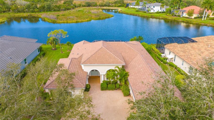 Located on one of the best lots in Silver Oak with expansive water views backed by private preserve (no houses in the back)* This executive home built by Bamboo Luxury Home Bui8lders features a brand new $85,900 roof for lower insurance costs* Unique great room floor plan with 14 ft. ceilings* 3 generous bedrooms plus large office/library* 3.5 baths* Kitchen with new granite counters & new wall oven* Plantation shutters* Recently re-finished & remodeled pool & outdoor kitchen* "Picture Frame Screening" has been installed for unobstructed views of the lake & preserve* Neutral tile throughout living areas with easy care vinyl floors in bedrooms* Master bath has new cabinets & granite counters* Whole house generator* Crown moldings & tray ceilings in master bedroom & great room* New hot water heater* Great room with built in entertainment center & decorative fireplace* 3 car split courtyard garage*  Master bedroom has 2 walk-in  closets* Silver Oak is located on Palmer Ranch close to shopping, Legacy Trail & minutes to world famous Siesta Key Beach* All homes in Silver Oak were built by Sarasota's highest rated custom home builders*