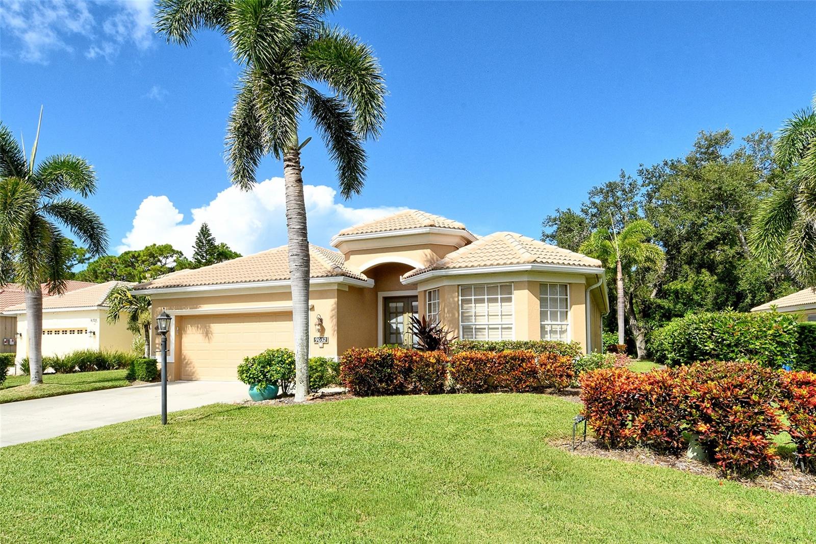 This is a rare opportunity to own a custom-built Lee Wetherington home in the maintenance-free, gated community of Willowbrook. Ideally located on the west side of Palmer Ranch, this residence places you even closer to the world-renowned, sugar-white sands of Siesta Key.
This pristine three-bedroom, two-bath home also features a beautifully appointed den/office with French glass doors, engineered wood flooring, grass cloth walls, and plantation shutters throughout. Step through the front French glass doors and be welcomed by a grand entry with tray ceiling, crown molding, and striking architectural details.
The open family room and chef’s kitchen overlook a serene tropical preserve with cascading lakes in the distance. The kitchen boasts granite countertops, a central island with double stainless-steel sinks, newer stainless-steel appliances, a four-burner gas range, handsome 42” wood cabinetry, glass block lighting and a designer backsplash. A breakfast nook offers sweeping preserve and lake views.
The carpeted primary suite is a peaceful retreat with a tray ceiling and dual walk-in closets. The luxurious primary bath showcases a freestanding tub with a glass-block accent wall, step-in glass shower, spa-style towel alcove, and dual vanities with quartz countertops. A private door provides direct access to the expansive patio, which also leads to the community pool just steps away. The guest bath is equally impressive, featuring a glass-enclosed shower with river rock tile, bold designer wall coverings, and granite finishes.
Additional highlights include 5-inch baseboards, 8-foot doorways, a spacious laundry room with sink, and a 20’x21’ epoxy-floored garage with a hurricane-rated door and gasoline-powered generator capable of running the entire home, including A/C and refrigeration. The covered lanai with concrete flooring offers a tranquil setting for outdoor enjoyment.
Enjoy the rarely used community pool, bordered by preserve and lake views, offering a lifestyle of peace and serenity. HOA services include landscaping, irrigation, scheduled power washing every three years, and exterior painting every seven years.
Willowbrook’s prime location offers convenient access to Siesta Key, shopping, dining, golf courses, and the cultural attractions of downtown Sarasota.