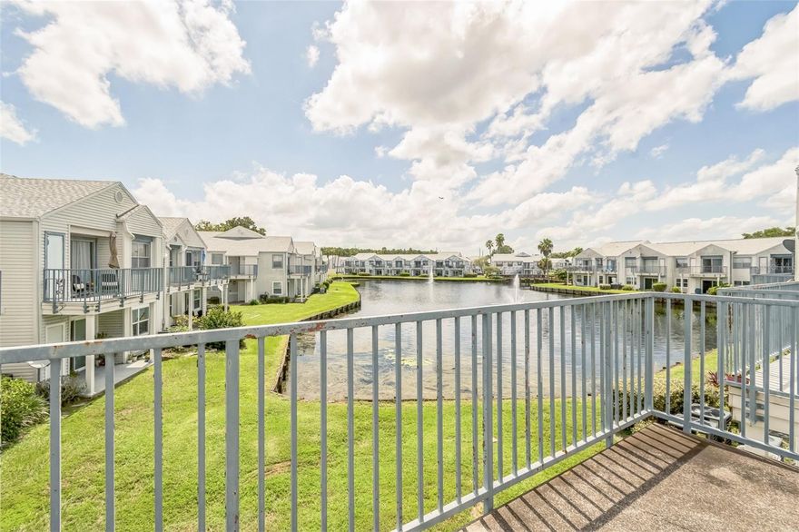 Tucked away in the Dockside Condo community, this second-floor unit offers a functional layout with an open-concept living and dining area, plus a private balcony that overlooks a peaceful water view. The kitchen includes a breakfast bar and connects easily to the main living space, making it perfect for casual meals or entertaining. Vaulted ceilings add a sense of openness, while large windows allow in plenty of natural light. The community itself features gated entry, a pool, and tennis courts, all surrounded by mature trees and serene landscaping. With convenient access to major highways, the airport, and plenty of dining and shopping options, this property offers great potential in a central location.