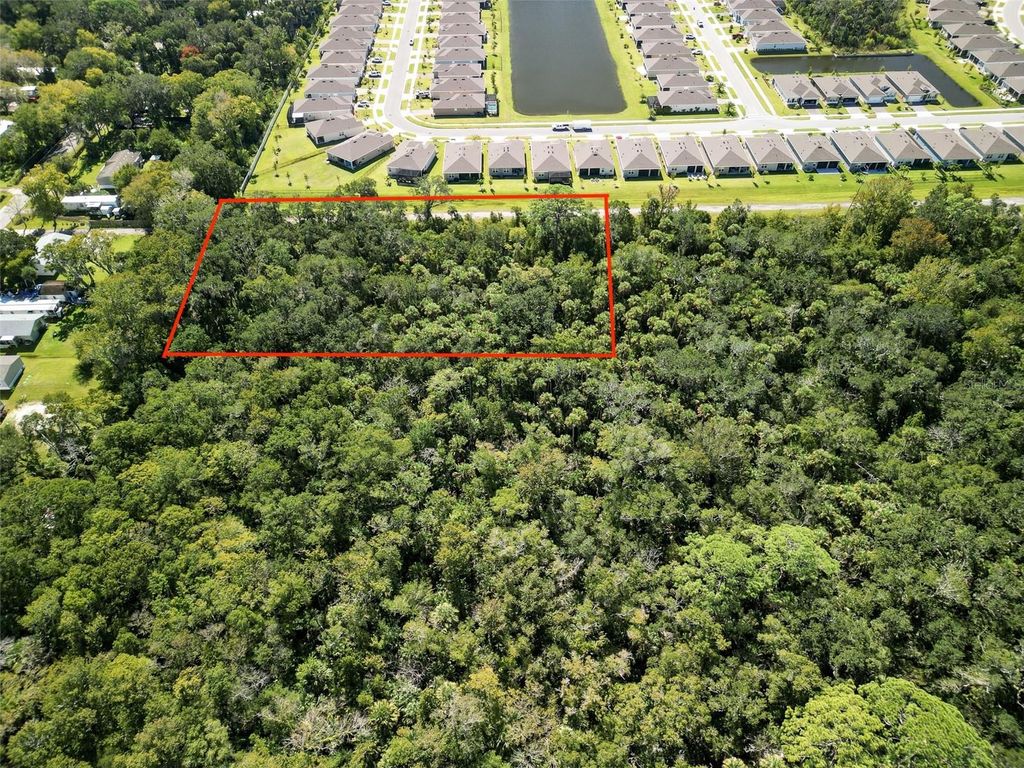 Photo of 1521 Ocuan Trail, New Smyrna Beach, FL 32168 (MLS # NS1086206)