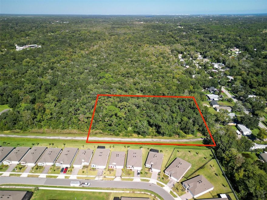 Build your dream home and enjoy privacy and convenience on this beautiful 2.5-acre parcel behind a gated entry on a quiet private road. The perfect spot for your custom home or retreat—close to shopping, golf, and just 5 miles to the beach!