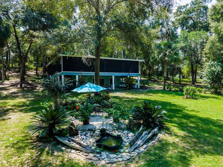 $170,000 BELOW 2024 APPRAISED VALUE! Appraisal is on file and willing to be shared. Don't miss this 2.2-acre property and home on Rodman Reservoir and Ocklawaha River (Greenway Recreation Area is located between land and waterfront). The home is 2 stories including 3,072 living square feet with full living quarters upstairs and downstairs. Upstairs is 1536 square feet with a wrap-around screened porch and includes 3 bedrooms & 2 bathrooms. The living room and kitchen are spacious, with an open floor plan and a wood-burning fireplace. The kitchen includes custom wood cabinets and lots of counter space, and all appliances (range, refrigerator, D/W & microwave) are included. The generous main bedroom has an ensuite bathroom, including a shower and tub. Guest bedrooms have sliders leading to the wrap-around porch. Downstairs is 1536 living square feet with an open floor plan of living room and full kitchen, plus a slider leading to a covered front porch with lake views. Includes one bedroom, one bathroom, laundry room and bonus room perfect for office/den or game room. Outside is a beautifully manicured lawn with mature landscaping and a storage shed. New well pump, drop and wiring just completed!

Rodman Reservoir, or Lake Ocklawaha, is an artificial reservoir located on the Ocklawaha River in Putnam County and Marion County in north central Florida. The reservoir, located about 15 miles southwest of Palatka, is approximately 15 miles (24 km) in length, covers 13,000 acres (5,300 ha), and is located between State Road 19 on the east and State Road 315 on the west. It is also a premier largemouth bass fishery for Northeast Florida. Ocklawaha gets its name from the Ocklawaha River, which flows for 74 miles in total. Located 20 minutes from downtown Fort McCoy with a grocery store, doctor's office, pharmacy, hardware, gas station, pizza, and more. It is a short drive to Silver Springs, which includes Walmart, Lowes, Bealls, Outback, and many more of your favorite shopping spots and restaurants. Ocala is only another 10 minutes from Silver Springs with vibrant nightlife and lots of entertainment options and restaurants. Gainesville (Home of University of Florida Gators) is only 50 minutes to downtown. If you’re a fisherman or hunter or simply love hiking, canoeing, or kayaking, you are in luck! Minutes to Ocklawaha River, Ocala National Forest, and many natural springs (Salt Springs, Silver Glen Springs, Juniper Springs), horseback and walking trails, and off-road vehicle trails await your explorations. One-of-a-kind property and location! Ready for new owners!