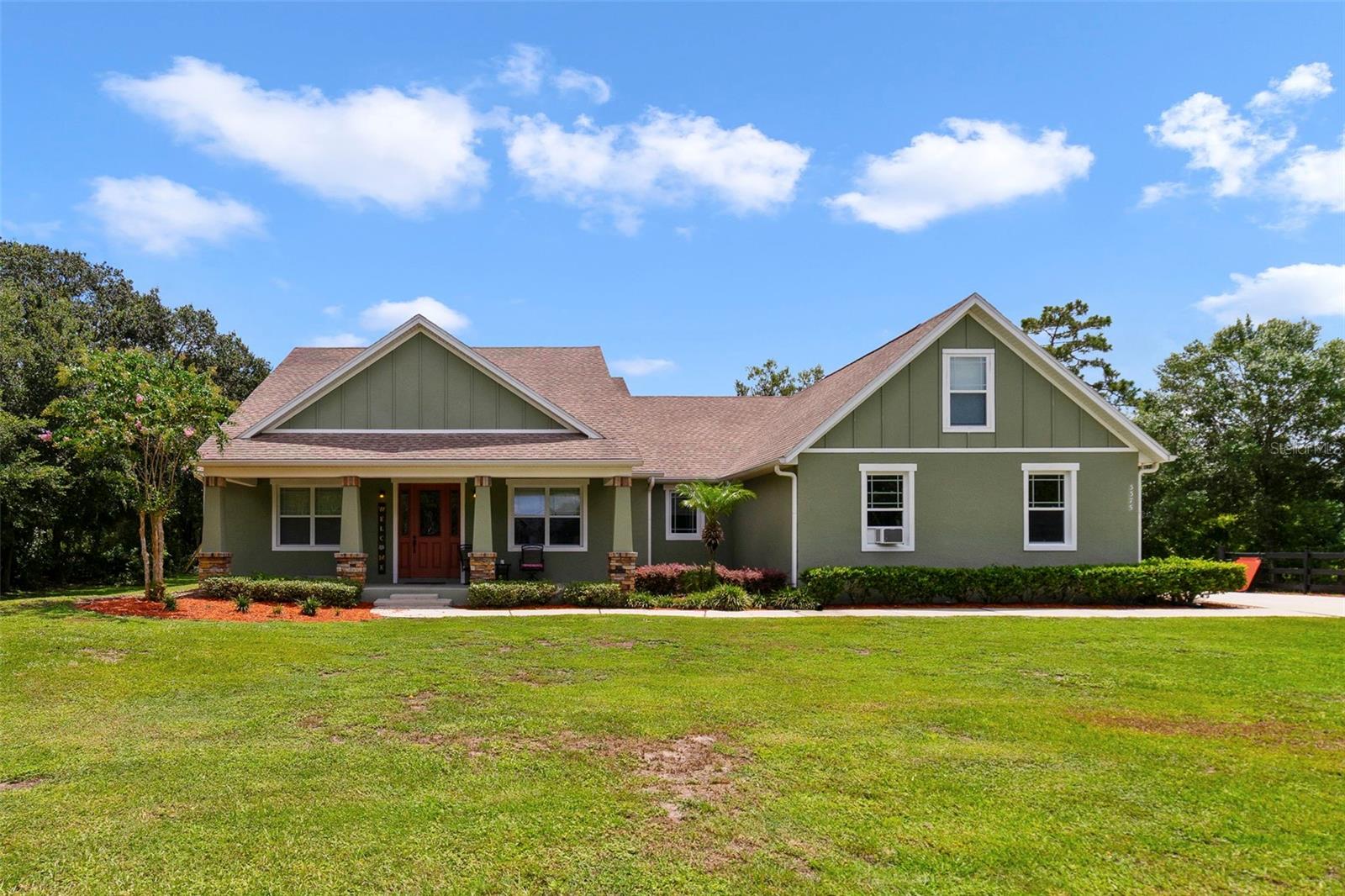 WELCOME TO COUNTRY LIVING IN THIS ABSOLUTELY BEAUTIFUL HOME ON 2 ACRES. The inviting front porch is a perfect place to relax or watch the sun set. This amazing home features 2,543 square feet of living area with 3,768 total square feet under roof. The first floor features an entrance foyer, formal dining room (currently being used as a living room), family room with French doors to the backyard patio, gourmet kitchen, dinette eating area, 3 bedrooms on one side of the home, all with walk-in closets and a full bathroom. Split plan with the primary bedroom on the other side of the home with a very spacious primary bathroom, 2 large walk-in closets, Split Vanities, private water closet and large walk-in shower. Inside utility and a half bath are in the hall leading to the upstairs 5th bedroom or bonus room. Mini split keeps this room very cool and plumbing for a bath is in place. The oversized garage is 24x22 feet. Lots of storage and a window AC to enjoy working on your projects. Zoning allows for horses and is completely fenced. The back of the property has a water pond and storage shed. Plenty of mature trees and room for all your favorite critters! NO HOA here. A new well pump was installed in 2021. Water chlorinator and softener are also included. All kitchen appliances as well as the washer and dryer convey. Call today for a home preview of your new piece of paradise in the country!