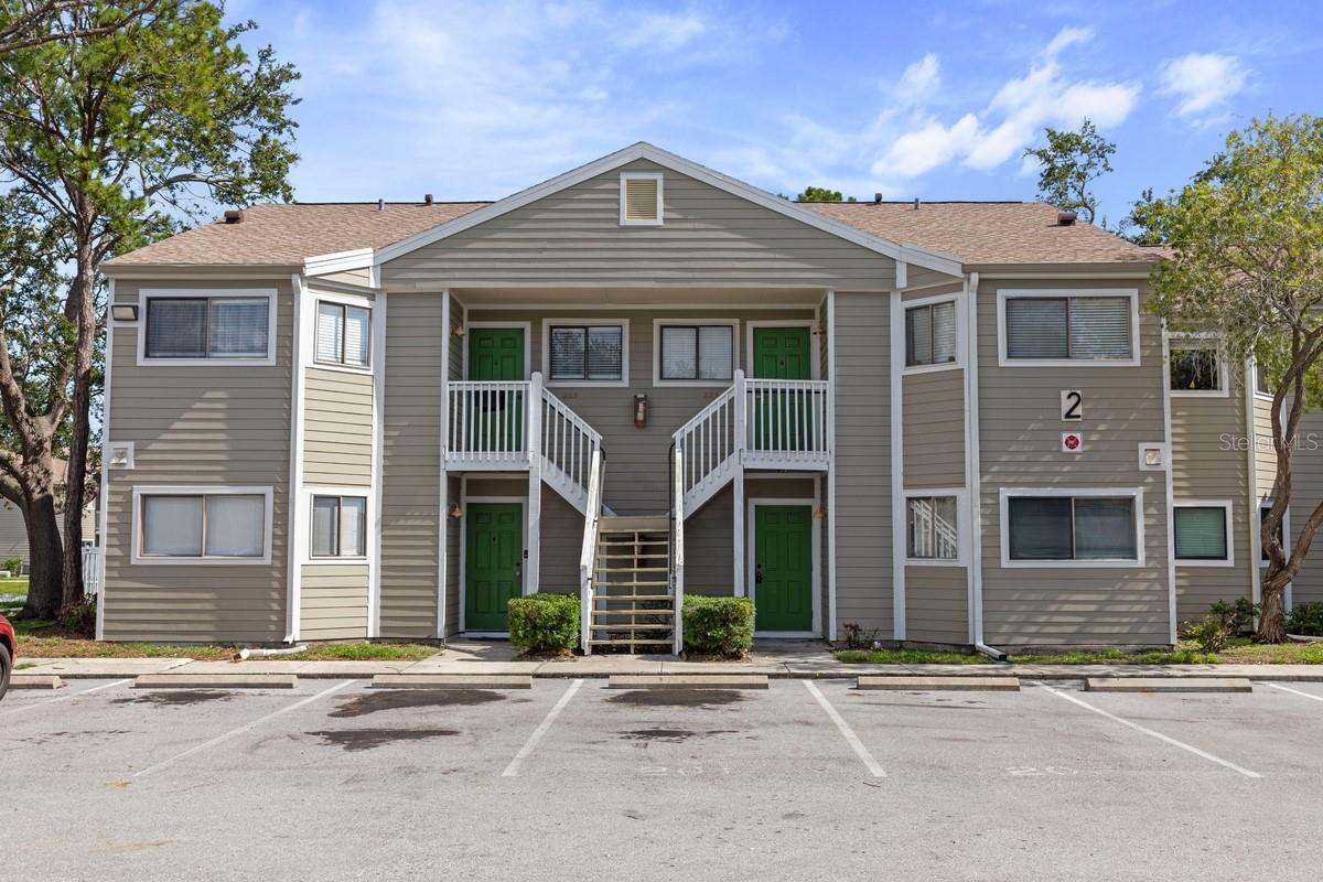 Enjoy effortless, single-level living in this updated ground-floor unit no stairs, no hassle. Featuring a spacious living area, open-concept kitchen with stainless appliances, fully updated bath, and in-suite laundry hookups, all finished with easy-care ceramic tile throughout. Your assigned parking stall is located directly outside the front door for added convenience. Set in a gated community undergoing a full revitalization, with new roofs, siding, privacy fencing, a modern security system, refreshed pool, and lush landscaping. Enjoy Largo's flagship complex of amentias only minutes from Central Park, cultural centers, library and close to airports, beaches, and Downtown St. Pete. Ideal for downsizers seeking security, simplicity, and location.