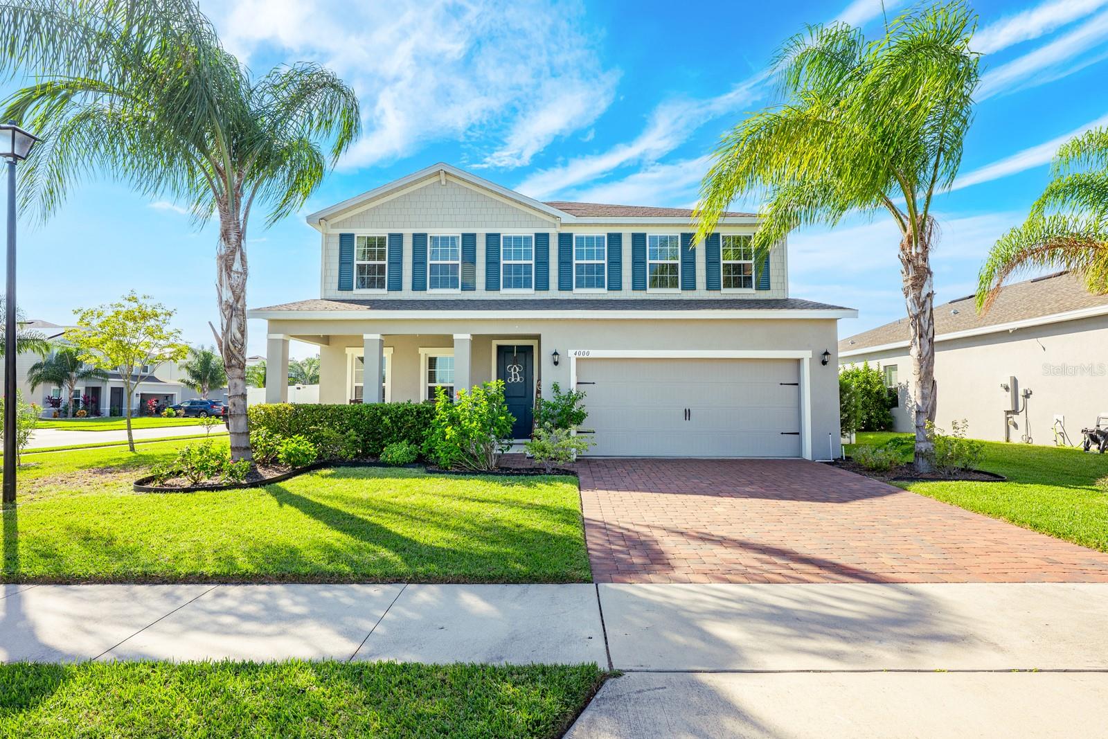 One or more photo(s) has been virtually staged. Seller may consider buyer concessions if made in an offer ~ Welcome to Kensington Reserve, a beautiful GATED COMMUNITY in the heart of Sanford offering fantastic AMENITIES - like a zero-entry pool, playground, and green space — and this spacious 2021 BUILT HOME that has everything you could want and more (including SOLAR!). Inside, a thoughtfully designed interior and OPEN FLOOR PLAN await with TILE FLOORING throughout the main level, a dedicated office (or 5th bedroom!), and a convenient half bath for guests. The spacious kitchen is a true showstopper – featuring shaker-style cabinetry, QUARTZ COUNTERTOPS, a large ISLAND with bar seating, STAINLESS STEEL APPLIANCES, recessed and pendant lighting, and a WALK-IN PANTRY. The kitchen is open to the living and dining areas and natural light fills every corner, creating a bright, welcoming vibe! The second floor is where you will find four comfortable bedrooms, the laundry room, and a large FLEX/BONUS/LOFT area perfect for a media room, playroom, or second living space. The PRIMARY SUITE is generously sized with excellent closet space (WALK-IN!) and a relaxing private bath. Enjoy Florida living outdoors with a large SCREENED LANAI, PRIVACY FENCED YARD, and plenty of space to play – complete with a LEMON TREE. The CORNER LOT adds to the sense of space, and the tandem 3-CAR GARAGE provides ample parking and storage. Thoughtful upgrades and systems include: a whole-home **SOLAR SYSTEM (2022)** to help keep energy costs low, WATER SOFTENER & FILTRATION SYSTEM, entire-home SURGE PROTECTOR, and new luxury vinyl plank flooring (2024) in the guest bedroom. Additional highlights include: double-pane windows, paver driveway, covered front porch, and beautiful landscaping that enhances the CURB APPEAL. Located just South of E Lake Mary Blvd, you are just minutes from SR 417, shopping, dining, lakes, and parks – making this the ideal home for convenience and comfort. MOVE IN READY and feels like new! Call today to schedule a tour and experience the versatile floor plan, endless natural light, and every modern comfort already done and in place. Welcome to Kensington Reserve and your NEW HOME SWEET HOME!