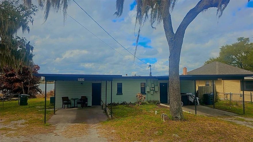 Rare find, both sides of duplex being sold together! Someone could live on one side & rent out the other or leave as is for immediate rental income. Each side is 2/1 with its own kitchen & living room, flex back room (could be living, dining, or another sleep area), carport, laundry hookup & fenced back yard overlooking the lake in back that has incredible sunsets! 

Side A has had kitchen & floors renovated and rents for $1400.00 per month on a lease through 10/26. 
Side B is original, is rented month to month for $1000.00 per month. 
Owner covers water & mowing, tenants cover the rest of their own utilities. 

Concrete block, flat roof, lakefront in very convenient location to Winter Haven, Bartow, and Lakeland.