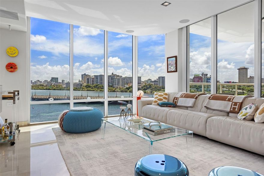 Experience refined living at Laguna Plaza Condominium Residence 401, a stunning 2,747 square foot home in the heart of San Juan's most exclusive neighborhood. This modern residence offers 3 bedrooms, two full bathrooms, and a powder room. Located in the South Tower, it boasts breathtaking views of Condado Lagoon, the North Atlantic Ocean, and San Juan's vibrant skyline, including landmarks like Distrito T-Mobile and San Juan Marinas.

Step into elegance with private elevator access leading into a spacious entry vestibule. Floor-to-ceiling sliding glass doors illuminate marble floors under nine-and-a-half-foot ceilings, complemented by recessed lighting and a state-of-the-art audio system.

The gourmet kitchen is a culinary masterpiece featuring Pedini cabinetry in neutral colors, Sub-Zero refrigeration, including a 102 capacity wine storage, and a full suite of Miele appliances. From the induction cooktop to the speed oven and integrated coffee maker, every detail is crafted for culinary excellence. The open-concept design seamlessly connects the kitchen to the dining and living areas, creating a perfect space for entertaining. Step out into the expansive balcony, perfect for enjoying San Juan's tropical sunsets.

The primary suit is a sanctuary with a Victoria & Albert standalone bathtub, frameless glass-enclosed rain shower, premium Italian cabinetry, and imported stone vanity tops. An infrared sauna and custom Poliform walk-in wardrobe enhance the retreat, along with Intelli-Homes technology for seamless connectivity.

Laguna Plaza Condominium offers an unparalleled lifestyle with amenities including a pool, fitness center, lounge room, and terrace—all with 24/7 security and concierge service. The residence includes three assigned covered parking spaces, a full backup generator, water cistern, and storage.

Located near Luis Munoz Rivera Park, Old San Juan, private marinas, the Convention Center, Distrito T-Mobile, hotels, restaurants, and nightlife, Laguna Plaza Residence 401 is a rare opportunity in San Juan's most esteemed address. Enjoy the convenience of a 10-minute drive to and from Luis Munoz Marin Airport for seamless travel connections.