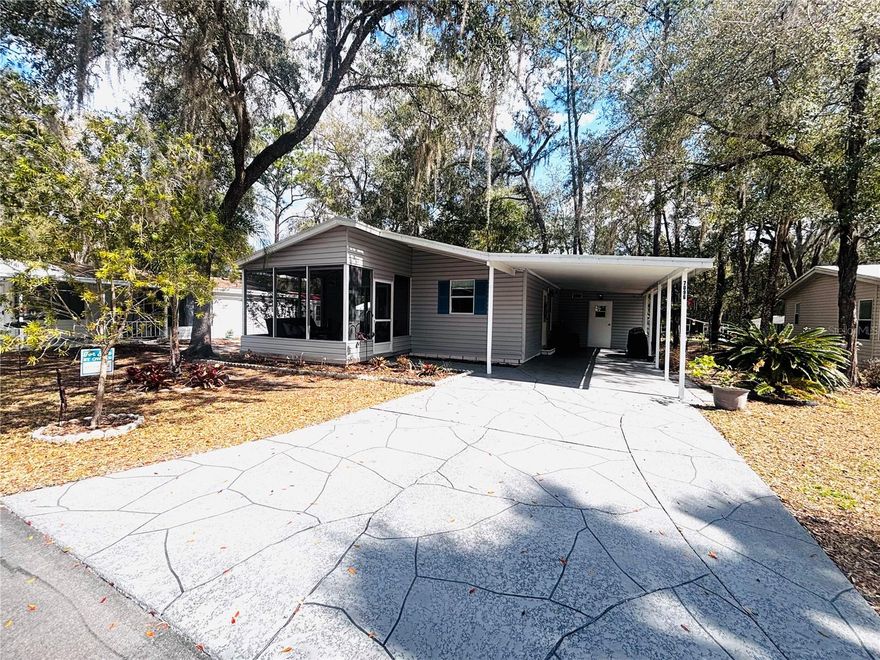 BEAUTIFUL BROOKSVILLE LOCATION !!! This 2 Bedroom, 2 Bath, 2 Carport Home is Move in Ready !!! Set on Park Like Property in a Small Secluded Community. Kitchen With Tons of Cabinets,  Storage Space and Built in Breakfast Bar. Living Room W/ Sliders to Screened in Front Porch Area. Primary Bedroom W/ Full Bath and Walk in Closet, Space for 2 Cars Under the Carport and an Outside Storage Shed Perfect for a Workshop. LOW HOA Includes Water, Sewer, Garbage, Cable, Internet, and Lawn Maintenance. The Community Clubhouse, Shuffleboard, Fishing Pond, and Community Pool are all Buzzing W/ Activity in This Over 55 Park. Overflow Parking is Available for Boats and RVS. Located Near Shopping, Restaurants, Medical Facilities and Golfing.