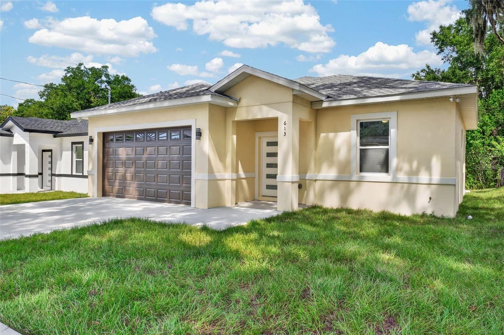 Photo of 613 W Valencia Street, Lakeland, FL 33805 (MLS # TB8552711)