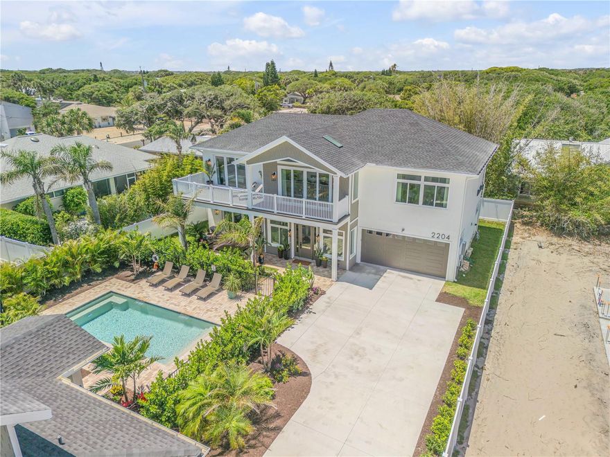 Two beachside homes built in 2023 in the short-term rental area, with a pool, and just steps to the ocean! This immaculate compound offers the epitome of Florida living, combining comfort, convenience, and coastal charm in a picturesque setting.  This is a unique setting with a main home that you can live in while renting out or hosting your family and friends in the guest home.  Both homes are SHORT-TERM RENTAL AREA zoned.  Built by Clancy Construction in 2023, every corner of these homes are of the highest quality.  The main home offers 3 bedrooms, one of which is on the first floor, and 3 ½ bathrooms.  The exquisite primary bedroom offers a balcony overlooking the pristine pool perfect to enjoy your morning coffee.  The ensuite bathroom has a large free-standing soaker tub and a large shower with tile surround.  Walk-in closets offer ample storage throughout the home.  Prepare culinary masterpieces in the chef's kitchen, featuring stainless steel appliances, a stylish tile backsplash, honed marble countertops, a transom window for natural light, a large pantry, and ample counter space for meal preparation.  This property is PERFECT for entertaining guests and family.  Additional features include an oversized 2 1/2 car garage, tile flooring throughout, tankless hot water heater, light and bright with an airy feel, skylights, water softener loop ready, a generator hook up, spray foam insulation, and all windows and doors are hurricane impact.  The beautifully designed heated, salt water, inground pool separates the main home from the guest home. It is fenced-in with a paver deck. The guest home comes FULLY FURNISHED and features three bedrooms, each with its own en-suite bathroom, providing luxurious accommodations for guests. The kitchen is equipped with granite countertops, stainless steel appliances, and a transom window for natural light.  There is luxury vinyl flooring throughout, combining style and durability. The open floor plan allows your guests to enjoy each other’s company yet still have a place to escape to their private rooms. Recently started with renting, this guest home is booking consistently, making it an excellent income-generating asset.  Embrace the coastal lifestyle with easy access to beachfront activities, dining, and leisure, ensuring endless opportunities for relaxation and enjoyment.  Don’t miss your chance to own this exceptional property.  Please schedule your private tour today!