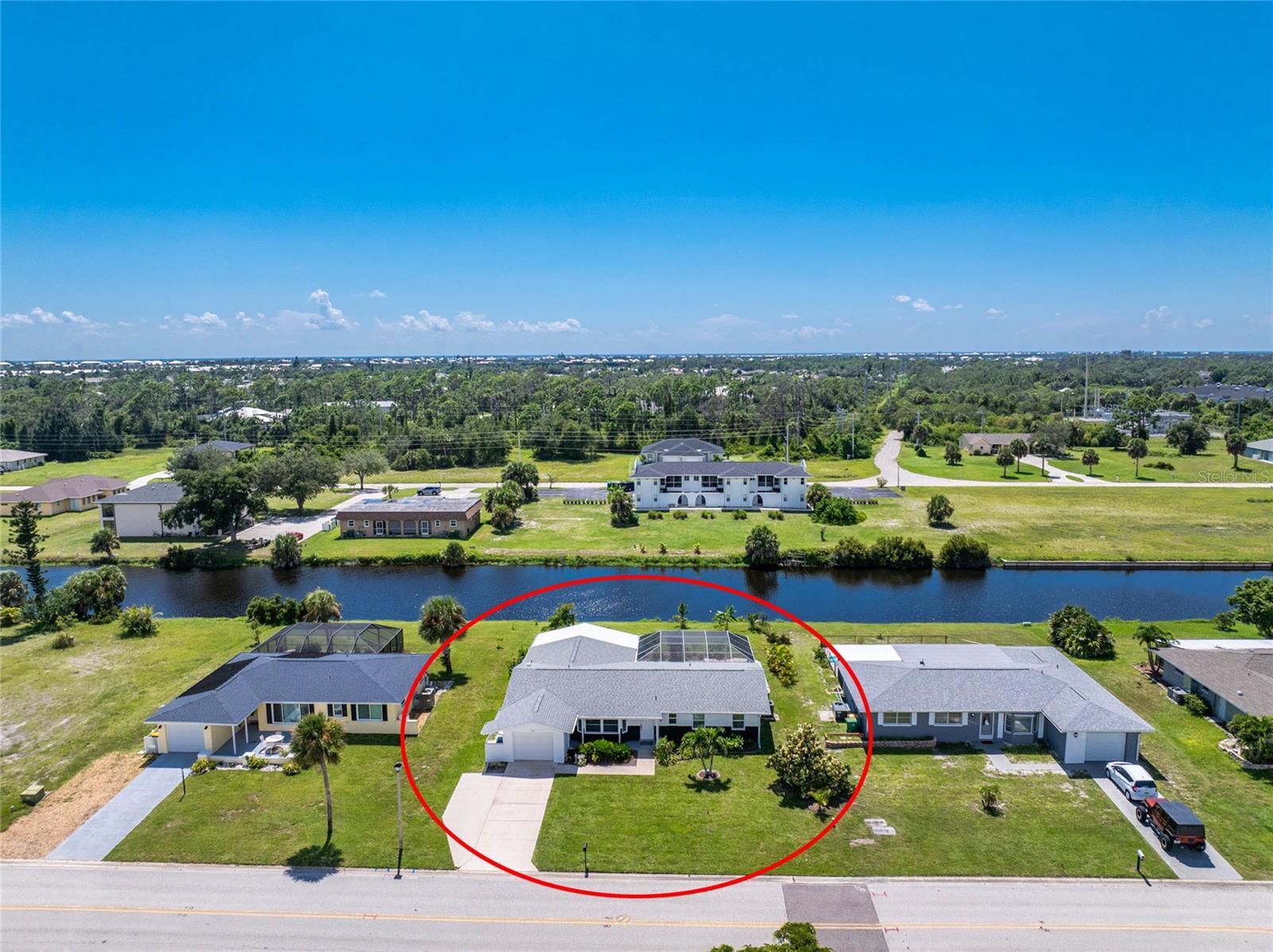 Nature’s Backyard: Sunsets, Waterfront Serenity, and Wildlife in the Premier Golfing Community of Rotonda West! This 3 bedroom, 2 bath pool home is being sold furnished, so you can move right in. Major updates were all completed in 2023 for peace of mind, including a new roof, impact windows and doors (sliders excluded), garage door (non-impact), and pool screen enclosure. In 2020, the attic insulation and ductwork were replaced. An additional parking pad extends from the driveway, while brick accents bring timeless charm to the exterior. Inside, a spacious great room welcomes you with tile flooring and a bay window that fills the space with natural light. The kitchen features plenty of white cabinetry, some open-style displays, granite countertops, a tray ceiling, and a pass-through to the dining area. A formal dining room and interior laundry room are located just off the kitchen, keeping entertaining and daily tasks convenient. The ensuite master bedroom offers a large reach-in closet, while a stylish barn door leads to the bathroom with a modern sink and a walk-in shower with rain shower head. Two guest bedrooms provide comfortable space for family or visitors, each with reach-in closets. The guest bathroom doubles as a pool bath with a separate access door and a large step-in shower. Outdoors, the pavered and partially covered lanai creates an inviting retreat with a heated pool, spacious entertaining area, and tranquil canal views. Fishing enthusiasts will love having the canal just steps away. Rotonda West is a deed-restricted community designed for a peaceful and scenic lifestyle. With 26 miles of canals, as well as lakes and ponds filled with wildlife, nature is always close at hand. Residents enjoy five golf courses, walking and biking trails, and a community clubhouse. Just minutes from sandy beaches, Lemon Bay, Boca Grande, and the Gulf of Mexico, the area offers world-class fishing, boating, and coastal living. Everyday conveniences including shopping, dining, and medical facilities are also nearby, creating the perfect balance of relaxation and accessibility. Contact us to schedule your private showing today at 141 Rotonda Circle.