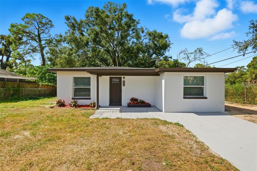 Welcome to 8904 Tupelo Drive, a beautifully renovated 4-bedroom, 2-bathroom home that perfectly combines modern design, comfort, and functionality. Nestled in the vibrant and family-friendly community of Temple Terrace, this home has been thoughtfully updated from top to bottom, offering brand-new finishes, modern fixtures, and all-new appliances. From the moment you arrive, you’ll notice the fresh curb appeal and inviting exterior that set the stage for the bright, contemporary interior within.

Step inside to discover an open and airy layout filled with natural light, where every detail has been carefully chosen to create a sense of warmth and sophistication. The modern kitchen is a true showpiece, featuring sleek cabinetry, quartz-style countertops, a stylish backsplash, and stainless steel appliances that make both cooking and entertaining a joy. The main living areas flow seamlessly, offering a comfortable space that’s perfect for family gatherings or quiet evenings at home.

One of this home’s standout features is the mother-in-law suite, complete with a private entrance. Whether you envision it as a guest retreat, home office, rental opportunity, or extended family living space, this addition provides flexibility that’s hard to find. It’s a versatile bonus that truly sets this property apart.

Each of the four bedrooms is spacious and inviting, while both bathrooms have been tastefully updated with modern tilework, elegant vanities, and designer-inspired finishes. Every space feels brand new and ready to enjoy.

Outside, you’ll find a generous backyard with additional storage, offering plenty of room for gardening, outdoor entertaining, or simply enjoying Florida’s sunshine. The mature trees and open layout create a private, peaceful retreat that complements the home’s interior charm.

Located just minutes from USF, Busch Gardens, the VA Hospital, Moffitt Cancer Center, and the Seminole Hard Rock Hotel & Casino, this home provides convenient access to everything Tampa Bay has to offer. With nearby parks, schools, shopping, and major highways like I-75 and I-4, you’ll enjoy easy commutes while maintaining the tranquility of Temple Terrace living.

With its modern design, flexible floor plan, and unbeatable location, 8904 Tupelo Drive offers a rare opportunity to experience comfort, convenience, and style in one exceptional home.