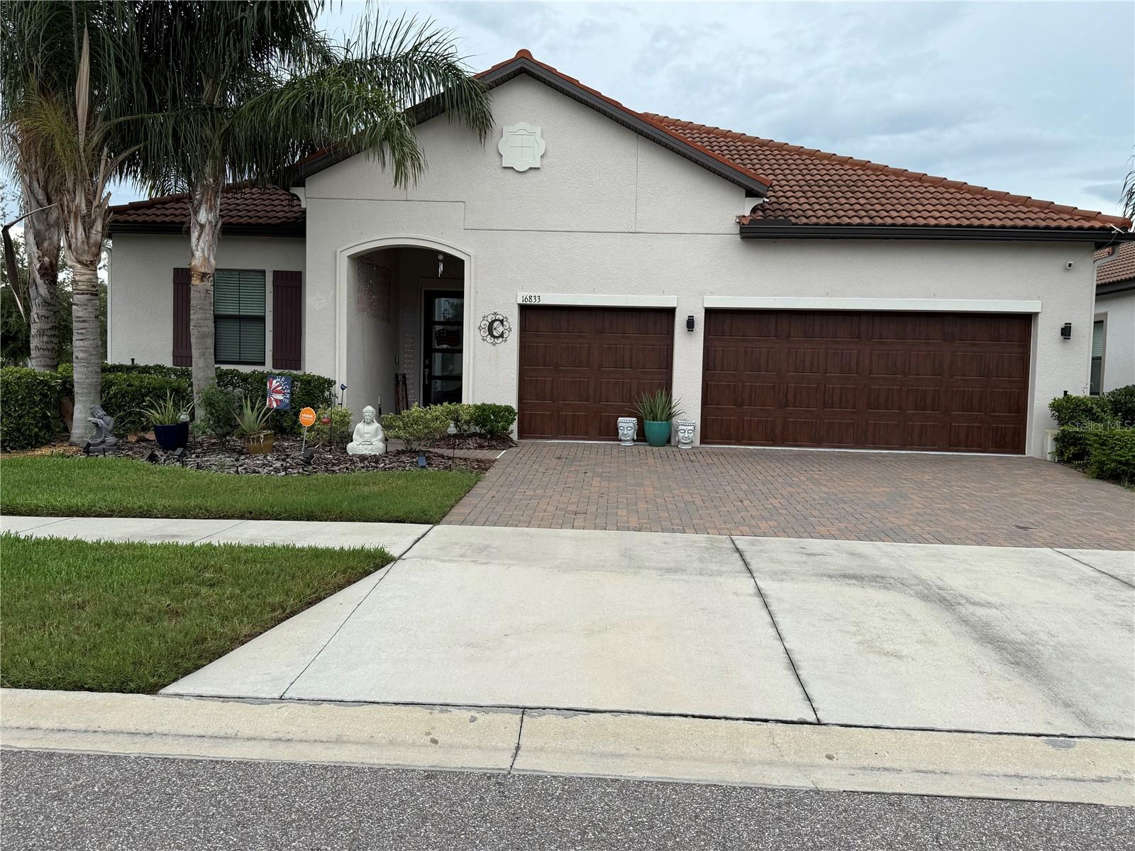 Highly Sought-After Home in Medley at Southshore Bay – Active Gated Community. Welcome to resort-style living in the prestigious Medley at Southshore Bay, a vibrant 55+ gated community offering an unbeatable lifestyle just steps from the stunning 5-acre Southshore Bay Lagoon. This beautifully maintained corner lot home boasts a serene water view and is only 6 years old, offering both modern construction and a warm, welcoming neighborhood of wonderful neighbors you’ll soon call friends.
Landscaped, Ranch style home with over 2,600 square feet of living space, this 3-bedroom, 3-bath home features an open concept layout, 10-foot ceilings, and an abundance of natural light. The spacious master suite includes a tray ceiling and updated luxury vinyl flooring, a luxurious walk-in shower and separate oversized soaking tub, walk-in closet featuring updated luxury vinyl flooring. Separate water closet. Each bedroom has its own walk-in closet, and the front bedroom is an ensuite—perfect for guests or multigenerational living.
Enjoy Florida living year-round with a covered lanai, extended by a screened-in birdcage, ideal for relaxing or entertaining with a water view as your backdrop. A bonus/flex room offers versatility for a home office, hobby space, media room.
Additional features include:
• 3-car garage with steps that lead to large storage room
• All-electric utilities
• In-ground sprinkler system
• Laundry room with built in shelving for storage and hanging clothes
• Vivint smart security system with video doorbell & electronic keypad front door lock
• Ring cameras (3 exterior, 1 interior)
• Omnishield fire detection system
• Culligan whole-house water softener with additional filter and reverse osmosis for kitchen sink
• Stone tile flooring throughout the house (carpeting in the two extra bedrooms only)
• Separate large island that includes double kitchen sink, dishwasher, with stone tiles that match backsplash
• Updated stone tile backsplash throughout entire kitchen
• Butler's pantry also with matching stone tile backsplash
• Electric flat top stove
• Separate built-in oven
• Microwave oven that is also a convection oven
• Lower kitchen cabinets have pull out storage shelves
• Crown molding upgrade (including master suite)
• Cordless push up blinds on all windows
• Upgraded hurricane impact 4-glass panel front entrance door
• 3-glass panel sliding rear door to lanai that opens from left and right sides
• HVAC system has UV light for improved air quality
• Hurricane shutters included
• HOA includes mowing, lawn care, sprinkler system maintenance, cable TV, and lagoon access
Community amenities are second to none, featuring a private clubhouse with indoor/outdoor bar, café, game rooms, ballroom, resort-style pool, pickleball and bocce courts, 2 dog parks, and golf cart access throughout the neighborhood (including access to lagoon).
Don’t miss the opportunity to own this exceptional home in one of the area’s most desirable 55+ communities!
Refrigerator, washer and dryer, TVs not included in sale (exception - outside lanai TV stays)