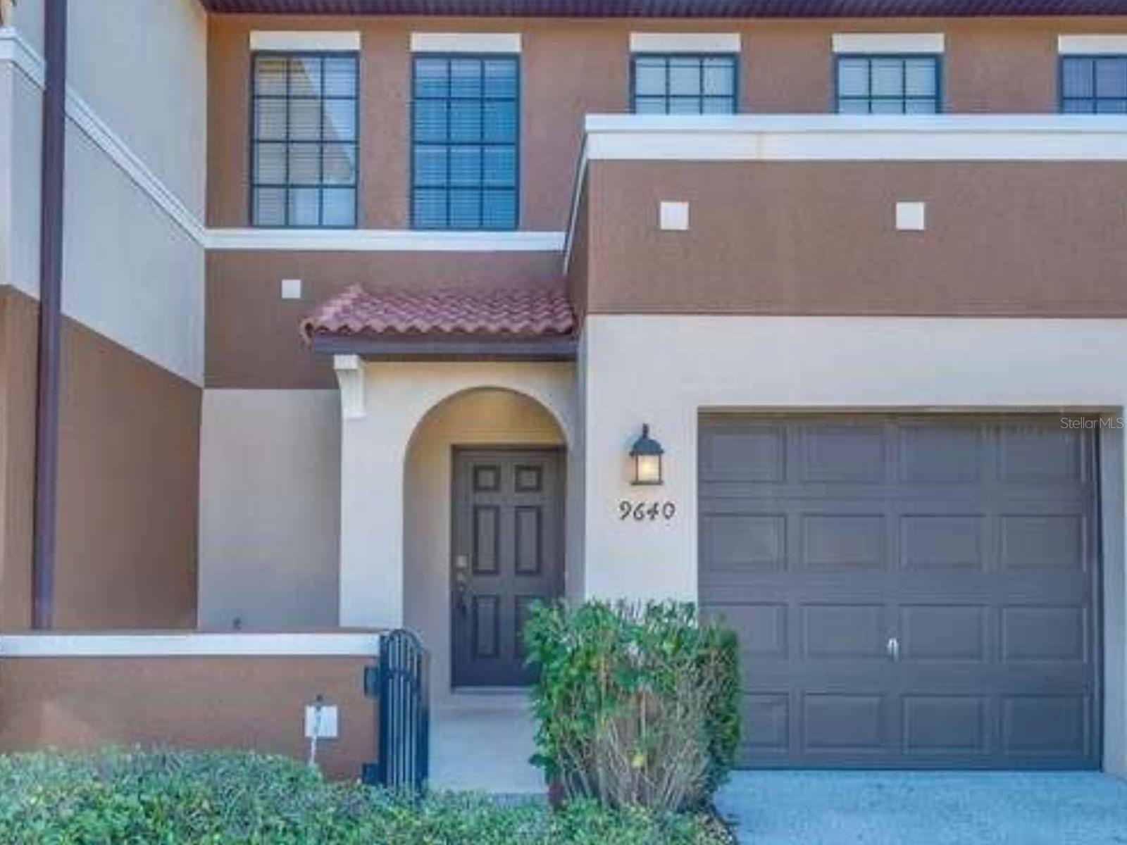 This beautiful 2 bedroom, 2.5 bath townhouse updated with new kitchen cabinets. Step into your private entryway opening to a vaulted ceiling leading you into this lovely home. Enjoy a large living/dining room with open views of the stylishly remodeled kitchen. Relax on the covered patio overseeing conservation views in the back. Upstairs leads you to two large master bedrooms each with its own private bathroom and walk-in closets. The laundry room is located upstairs for easy housekeeping. Located close to local schools, dining, and shopping centers and only 20 minutes from the Orlando International Airport, this lovely gated community offers a playground for the kiddies and a community pool perfect for lounging in the summer. Do not delay! This property will not last long!