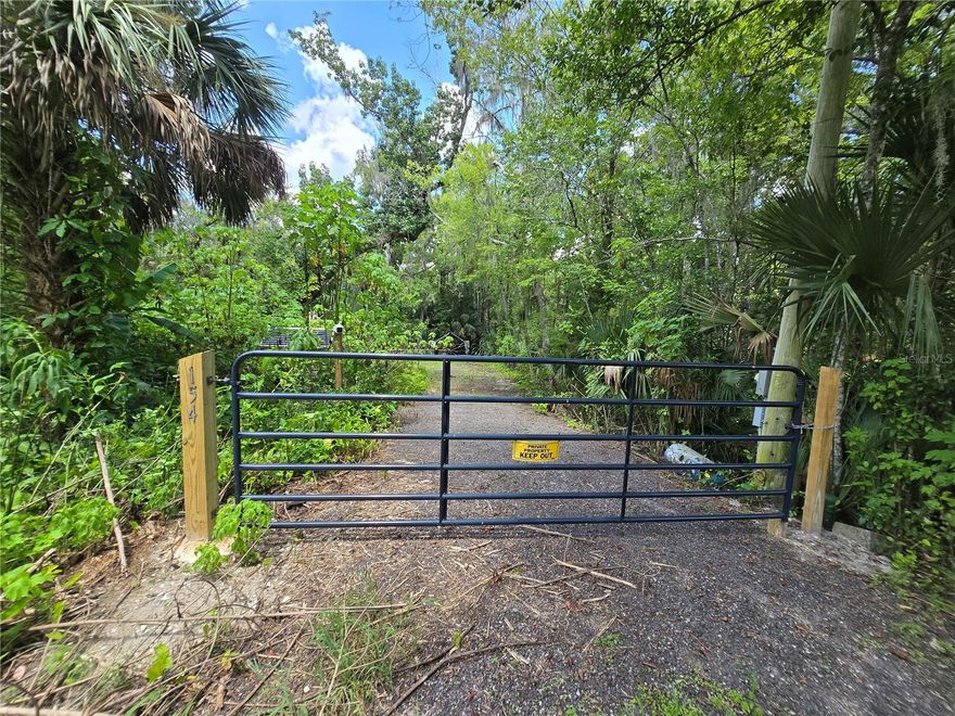 Discover a unique opportunity to own 80 feet of direct river frontage on the easternmost channel of the scenic Wekiva River. Located in Sanford, Florida and tucked away in a quiet, hidden location yet just minutes from shopping, dining, and everything Central Florida has to offer. This lot offers the perfect balance of convenience and seclusion. The property is thoughtfully equipped with a heavy-duty dual electric boat lift, an attached floating dock ideal for kayaking and paddle boarding, well, septic system, electric, and Wi-Fi already in place. A crushed asphalt drive leads to a designated RV spot, making it an excellent winter retreat. There's also a small metal utility building with a toilet, water pump and tank, and Wi-Fi connectivity. The owner had plans to build a stilted cabin, and an approved site plan. Whether you're looking to build your dream riverfront getaway or keep it as a private recreational retreat, this property is ready to enjoy. Explore Katie's Landing at the Lower Wekiva River Preserve State Park, you'll enjoy easy access to multiple trailheads, campsites, and the wonders of this federally recognized National Wild and Scenic River. The Wekiva River, one of only two rivers in Florida with this prestigious designation, boasts unpolluted waters, natural shorelines, and a connection to Central Florida's rich network of lakes, rivers, and springs. Conveniently located just 7 minutes from I-4 and 10 minutes from Sanford, this property provides the perfect blend of peace and tranquility with modern conveniences. With the recently completed State Road 29, enjoy effortless access to all that Central Florida has to offer.